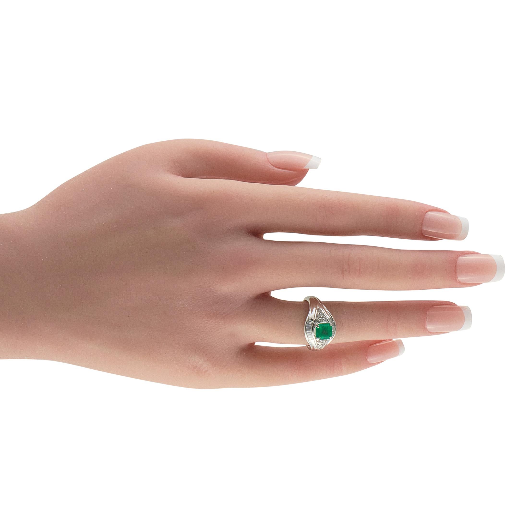 This radiant luxury ring is a piece that will elevate any jewelry collection. A bold Platinum setting beautifully showcases the vibrant 1.03 carat Emerald center stone. Diamond accents totaling 0.36 carats add a touch of traditional sparkle to the