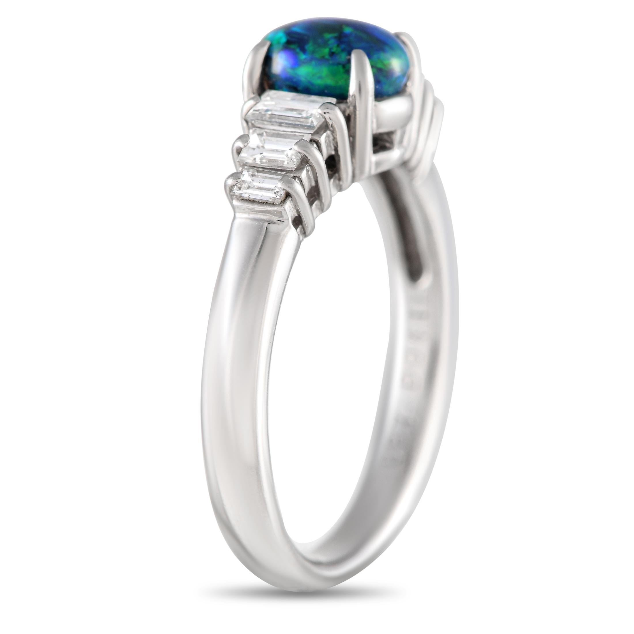 This simple, elegant ring will instantly capture your imagination. The 0.87 carat opal center stone serves as a stunning focal point thanks to its breathtaking combination of blue and green tones. Diamonds with a total weight of 0.41 carats elevate