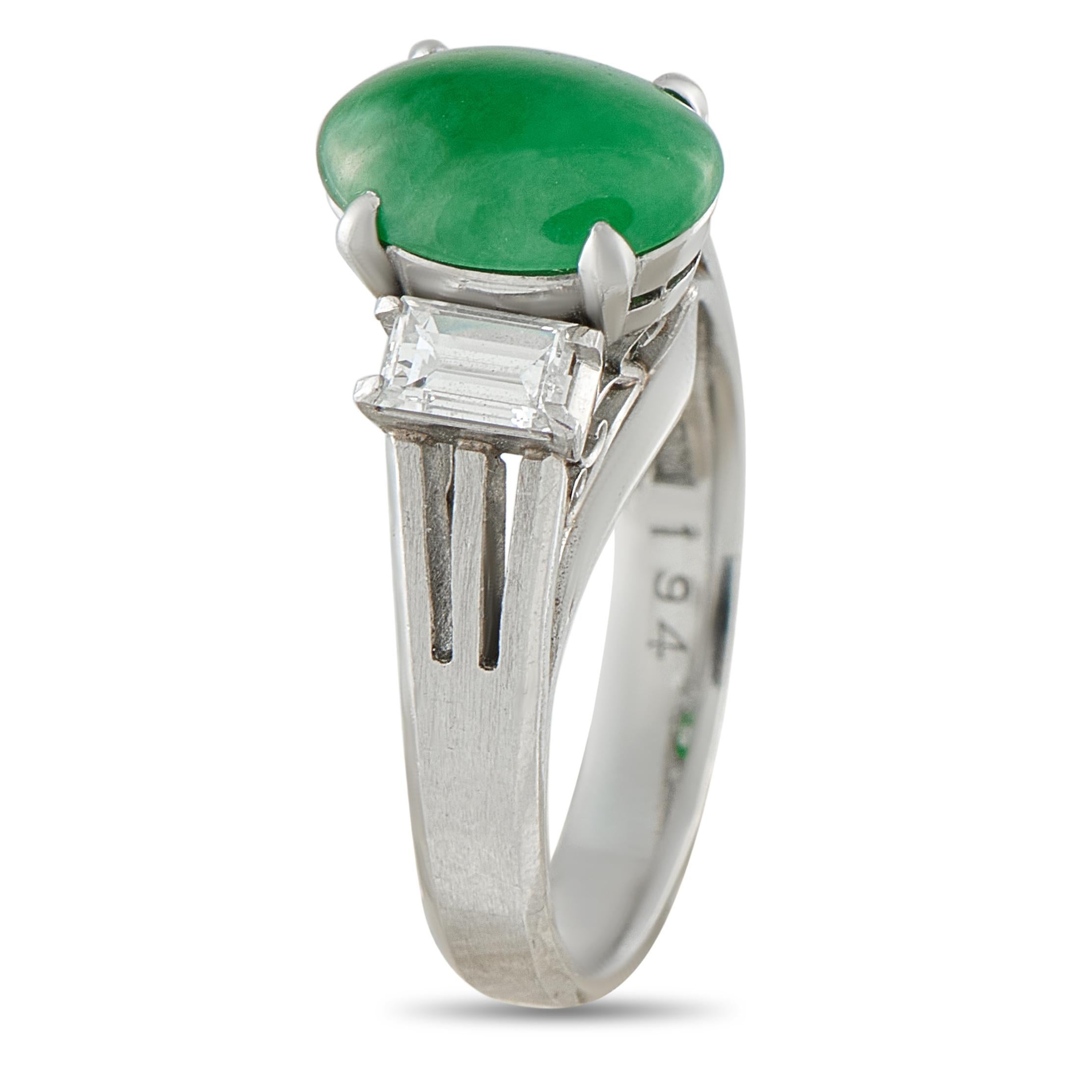 This rings Platinum setting is filled with exquisite details. Breathtaking from every angle, this piece beautifully showcases a 1.94 carat Jade cabochon and Diamond accents totaling 0.44 carats. Ideal for any occasion, it features a 4mm wide band