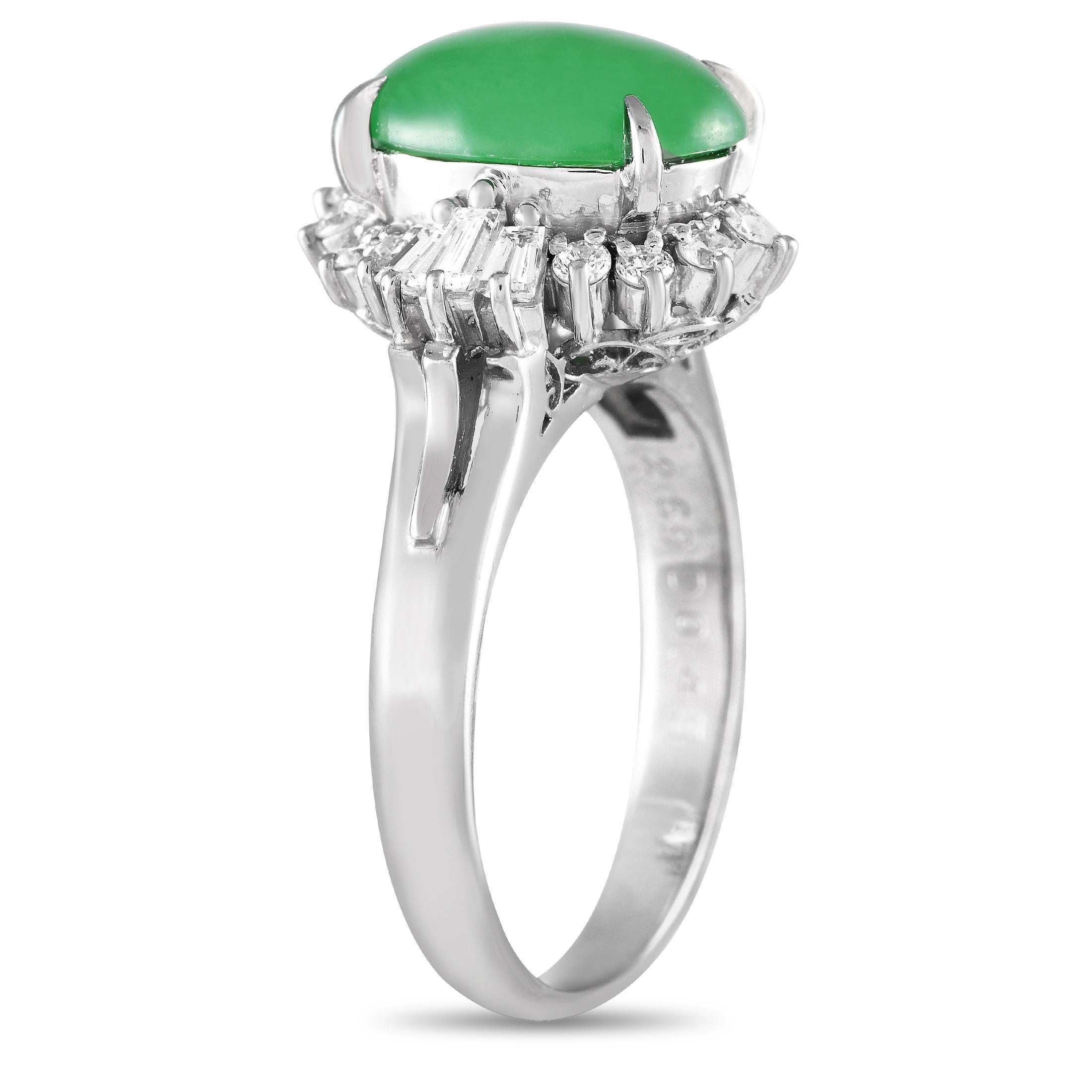 A 2.69 carat jade cabochon serves as a stunning focal point at the center of this elegant ring. Its also surrounded by a dynamic halo of diamonds with a total weight of 0.45 carats. This pieces shimmering platinum setting features a 2mm wide band