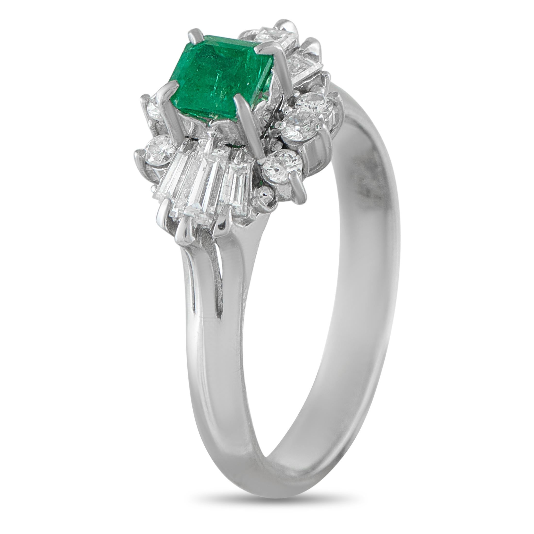Add a stylish pop of color to any ensemble with this simple, elegant ring. At the center of this pieces Platinum setting, a vibrant 0.45 carat Emerald is surrounded by a sparkling halo of Diamonds totaling 0.47 carats. A 3mm wide band and 10mm top