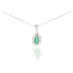 Platinum 0.48 Carat Emerald Diamond Halo Pendant Necklace