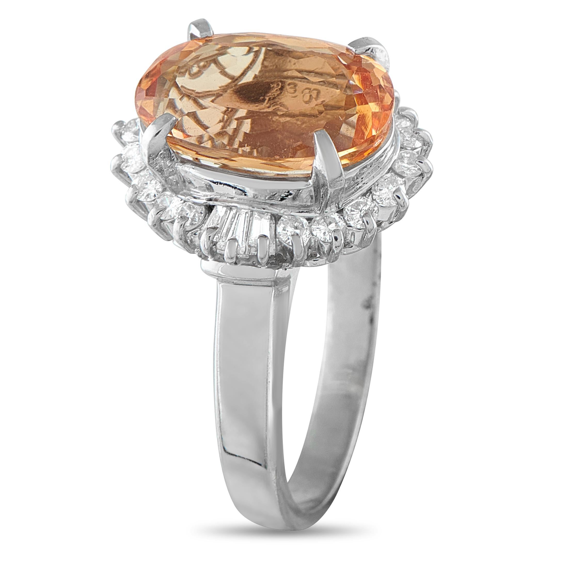 This luxury ring is poised to add a stylish pop of color to any outfit. At the center of the detailed Platinum setting, a radiant 5.80 carat Imperial Topaz gemstone serves as a stunning focal point. Its surrounded by a halo of Diamonds totaling 0.50