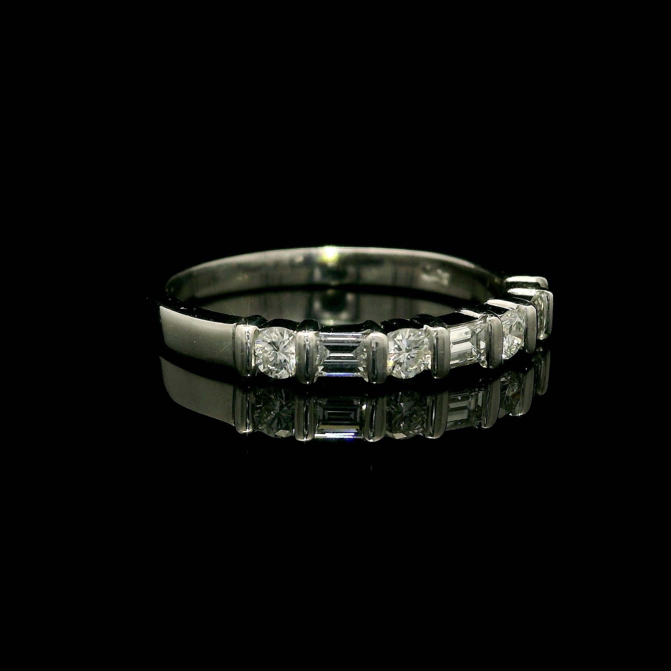 –Stone(s): –
(7) Natural Genuine Diamonds - 4 Round Brilliant & 3 Baguette Cut - Channel Bar Set - E/F Color - VVS1-VS1 clarity - 0.50ctw (approx.)

Material: Solid .900+ Platinum (tested) - Stamped PT900
Total Weight:  3.83 Grams
Overall Width: 2.9
