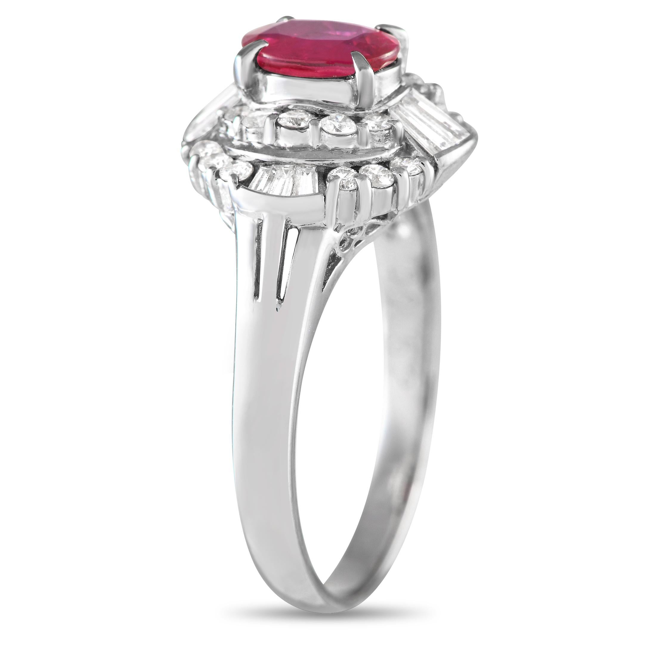 Angles and curves make up the alluring beauty of this diamond and ruby ring. Its platinum band features daintily split shoulders that support a stepped halo with tapered baguette and round diamonds. Taking centerstage is a 0.71 ct oval ruby secured