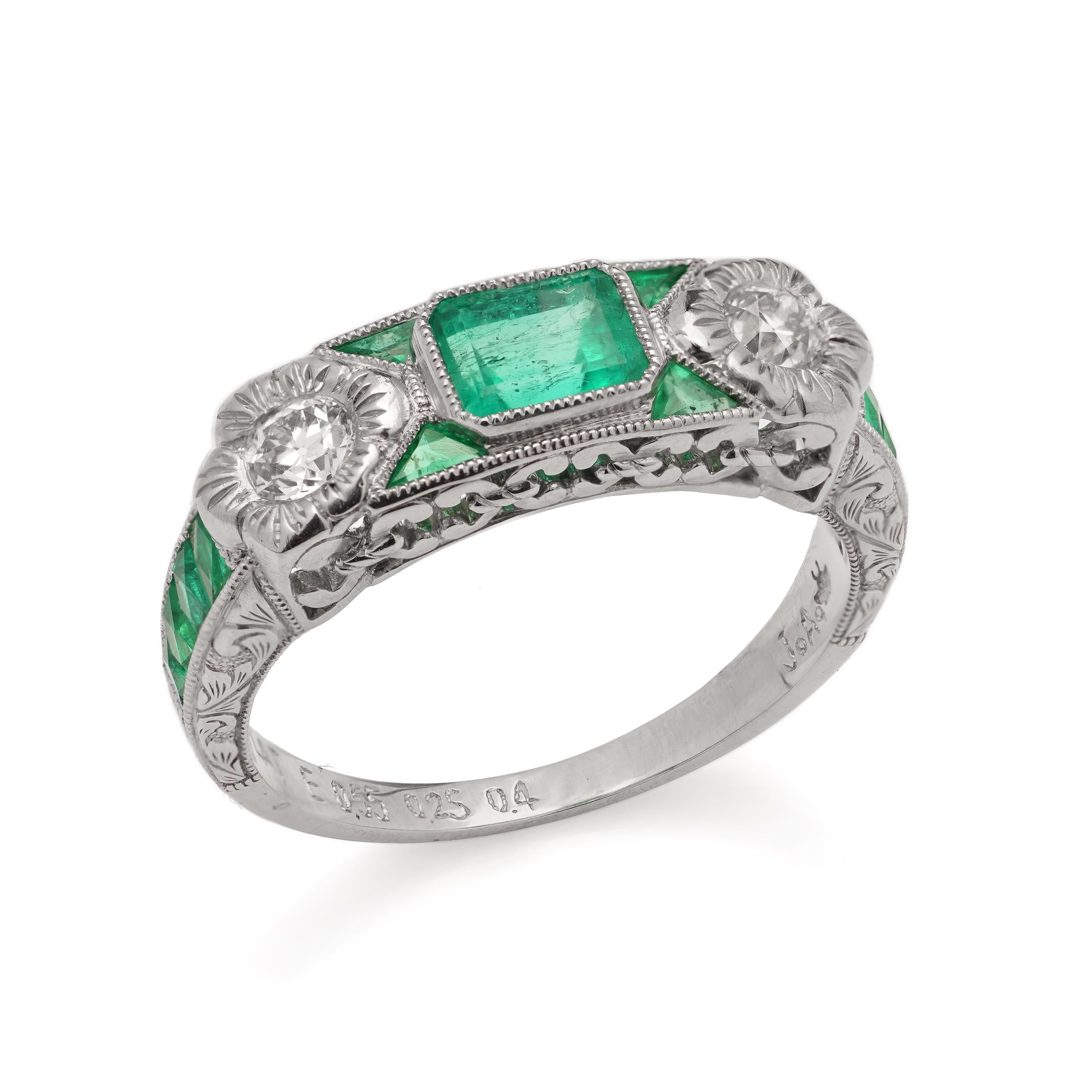 Platinum 0.55 carats of Emerald - cut Emerald ring, set with two round brilliant diamonds and baguette and triangle - cut emeralds.

Made in After 2000
Maker: JoAq 
X-Ray tested positive for .850 platinum purity. 

Dimensions - 
Finger Size (UK) = M