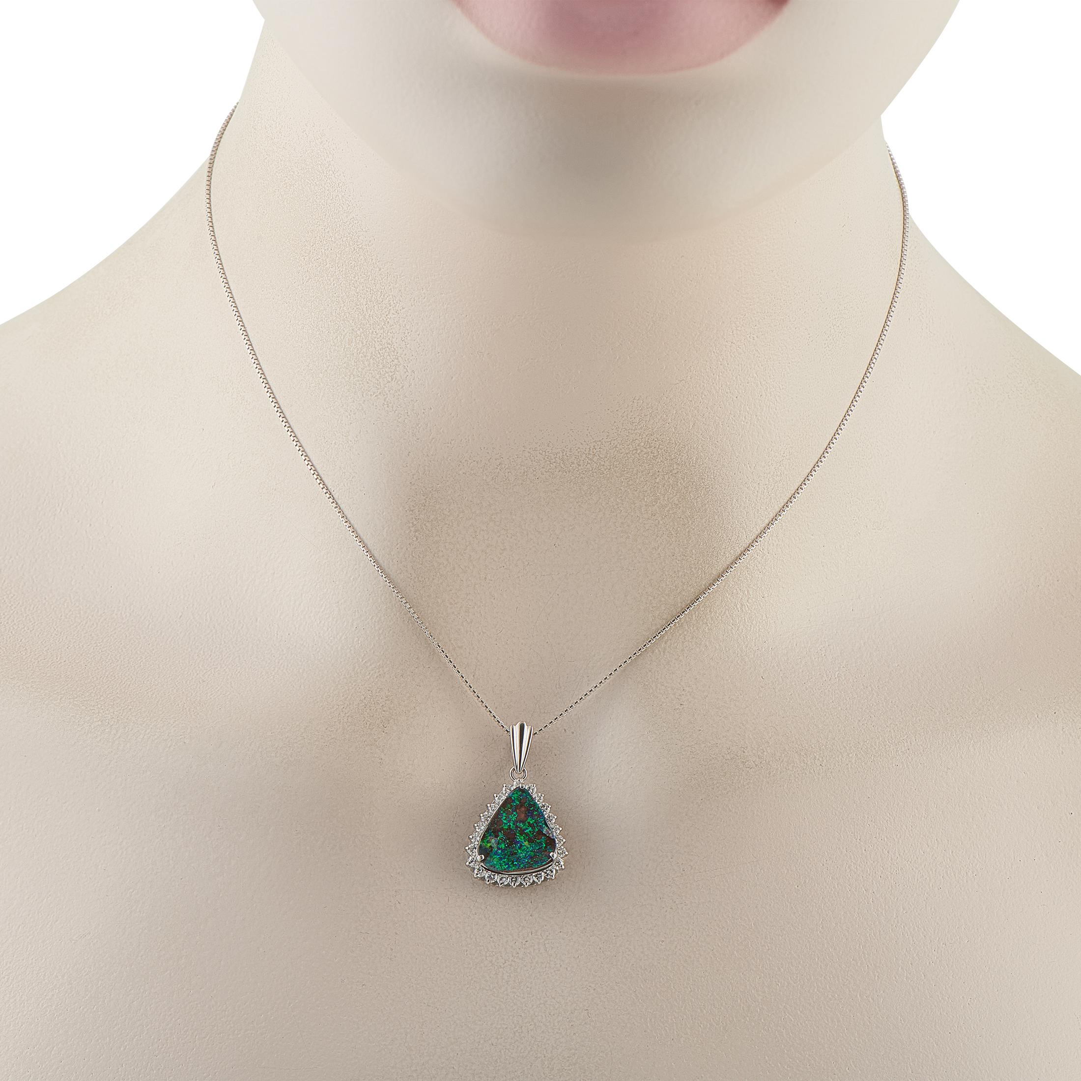 A genuinely unique piece, this necklace is designed with a 4.38-carat opal offering vibrant flashes of green, bronze, and blue-violet hues that seem to shift with every moment. The remarkable play of color is complemented by the gem's custom-cut