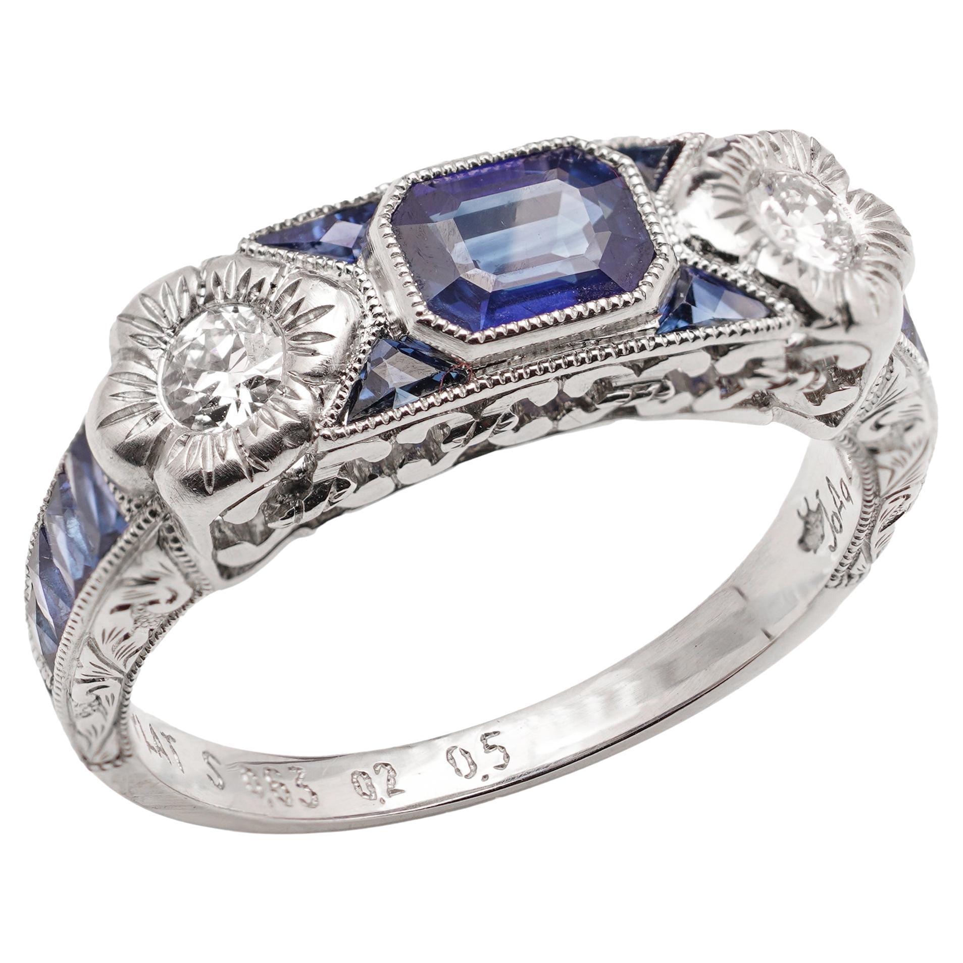 Platin 0,63 Karat Smaragd-Ring mit blauem Saphir im Schliff
