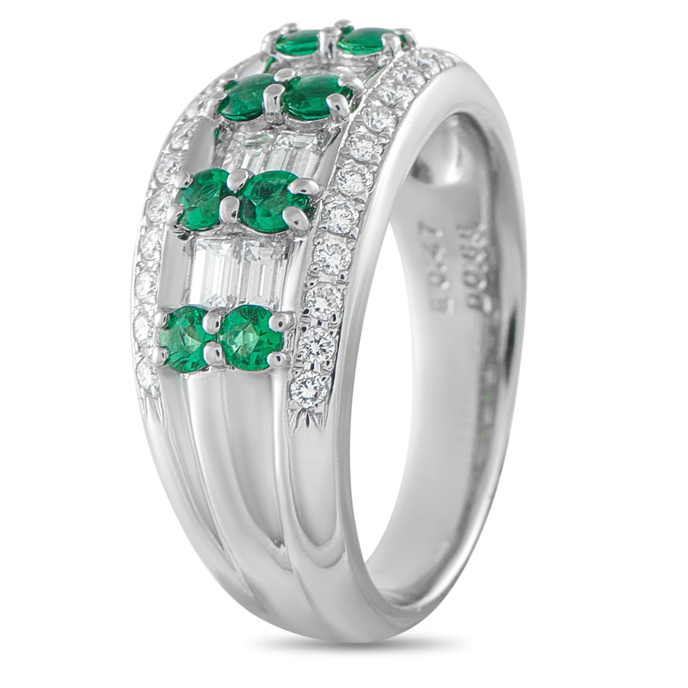An ring that charms with its geometric, Art Deco elegance. The platinum band widens at the center, creating a defined canvas for the elaborate setting. The top surface showcases four striking duos of round emeralds, each duo set between pairs of