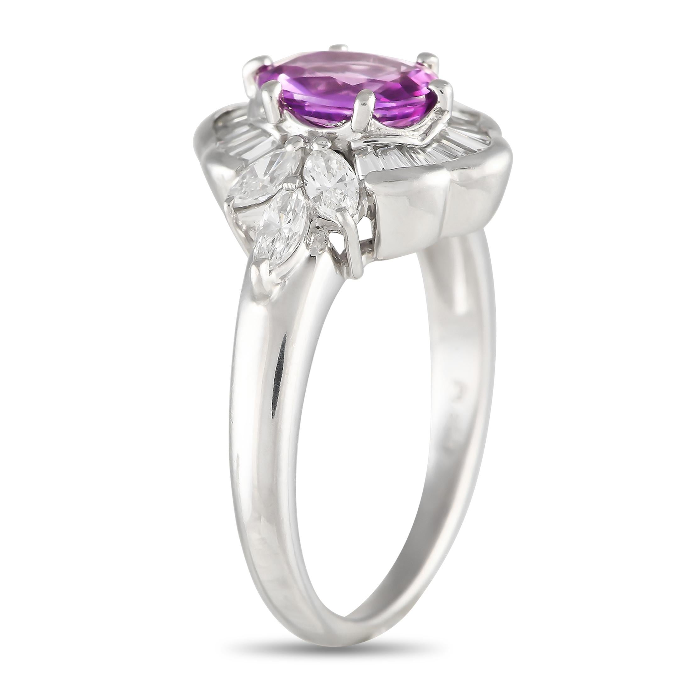 A captivating oval-cut 1.20 carat Pink Sapphire gemstone makes a statement at the center of this rings elegant Platinum setting. Elevated by a halo of sparkling Diamond accents totaling 0.67 carats, it features a 1mm wide band and a 6mm top