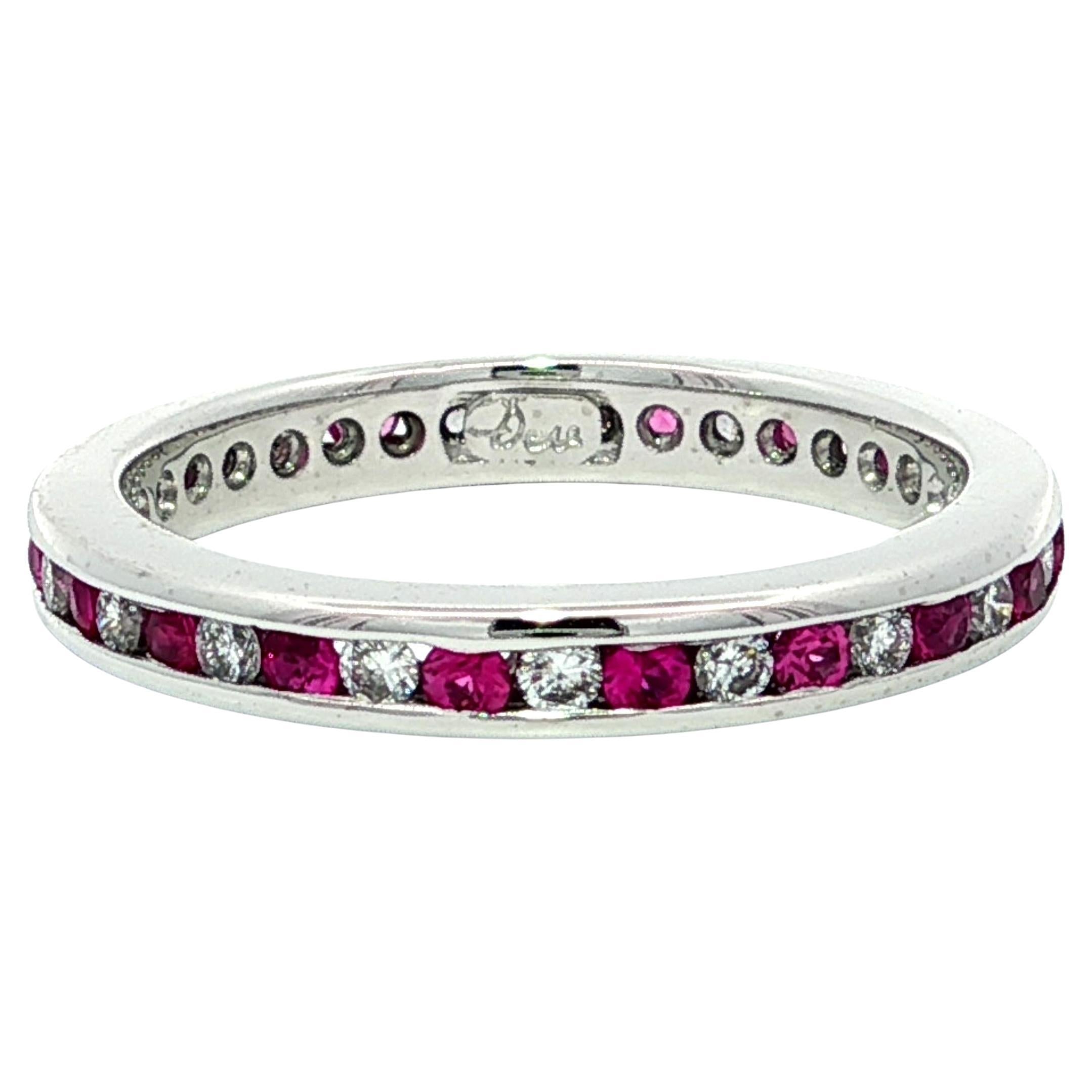 Anello in platino con zaffiro rosa e diamante a canale alternato da 0,68 ct.