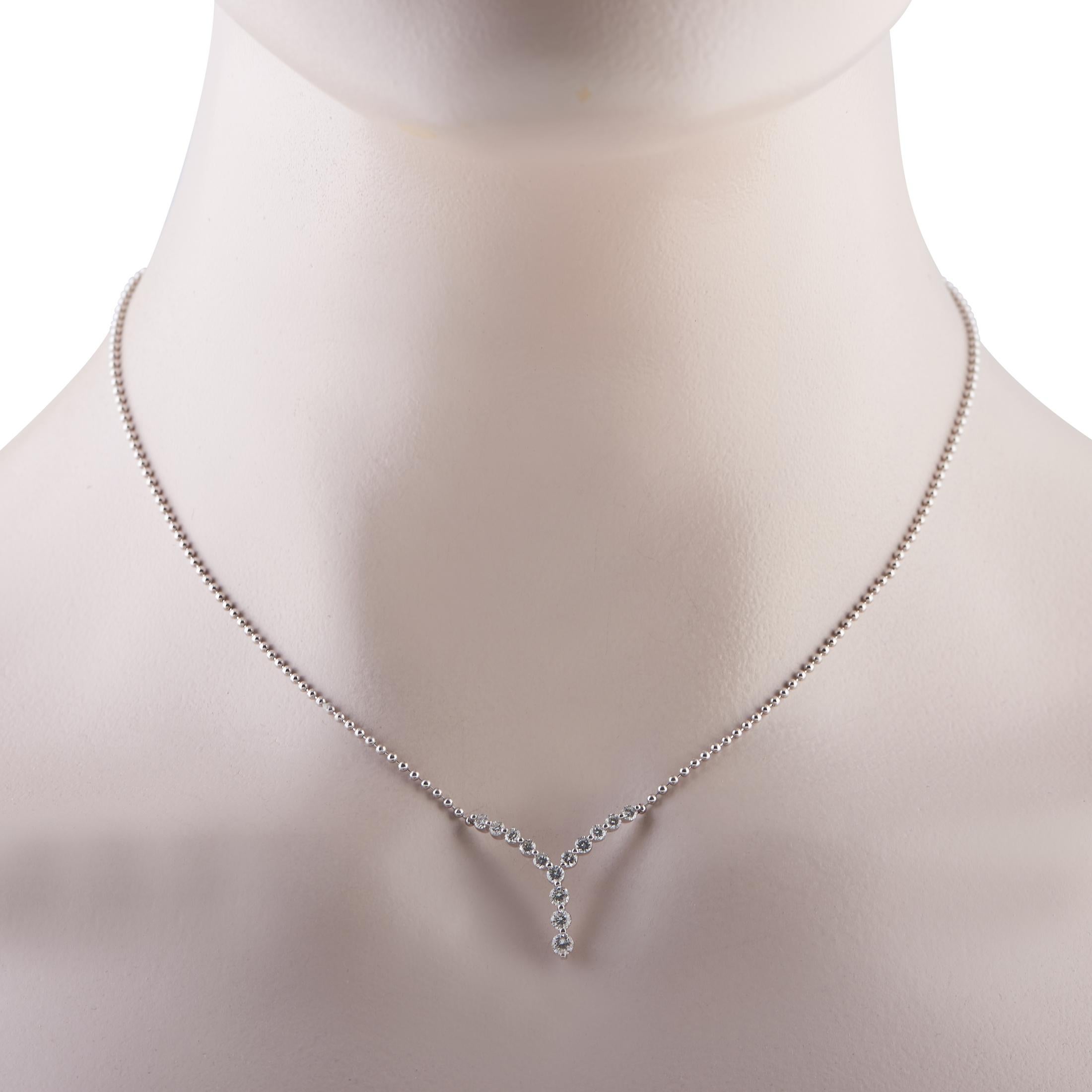 Modern and composed, this platinum necklace flatters the neckline and draws the eye upward. It features an 850 platinum ball chain seamlessly connected to a shimmering pendant shaped like a combination of a chevron and a softly curved Y. The pendant
