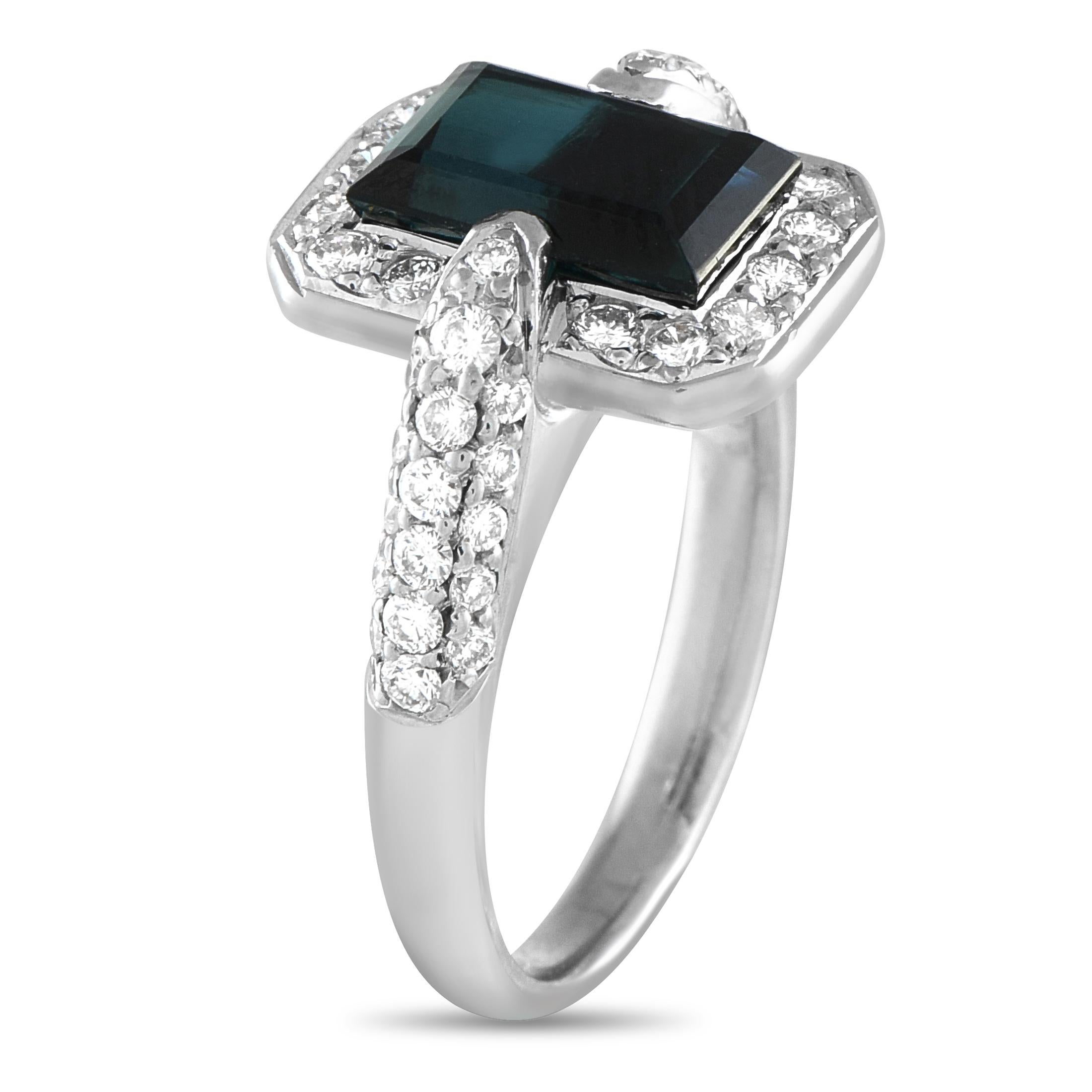 Of geometric glamour, this platinum ring is an heirloom in the making. It features an emerald-cut tourmaline that captures the essence of old-world stately elegance. A rounded rectangle frame of round diamonds surrounds the rich-colored gemstone.