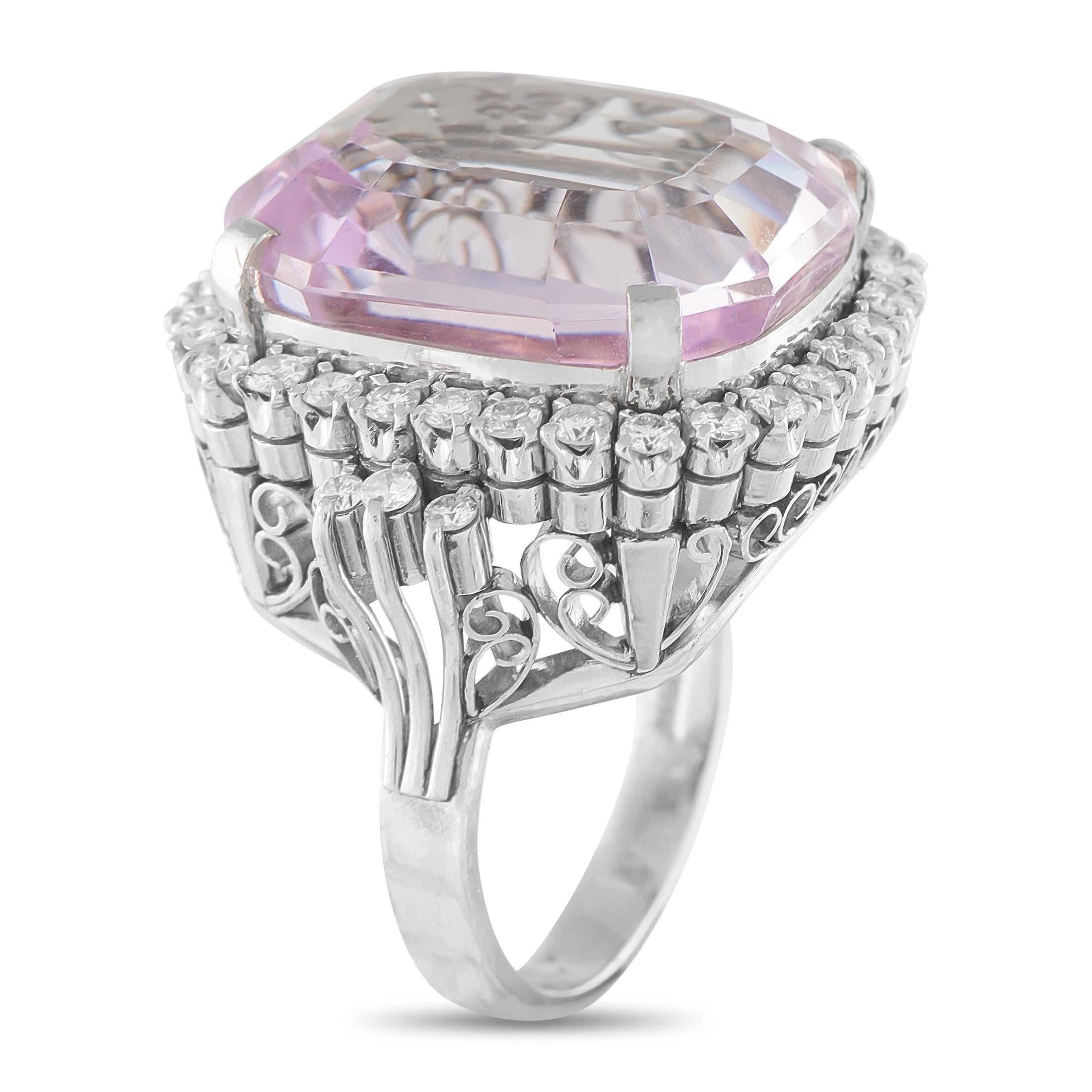 This statement-making ring will continually radiate light. Made with an intricate Platinum setting that looks stunning from any angle, sparkling Diamonds with a total weight of 0.80 carats surround the dazzling 19.0 carat Kunzite center stone. Bold