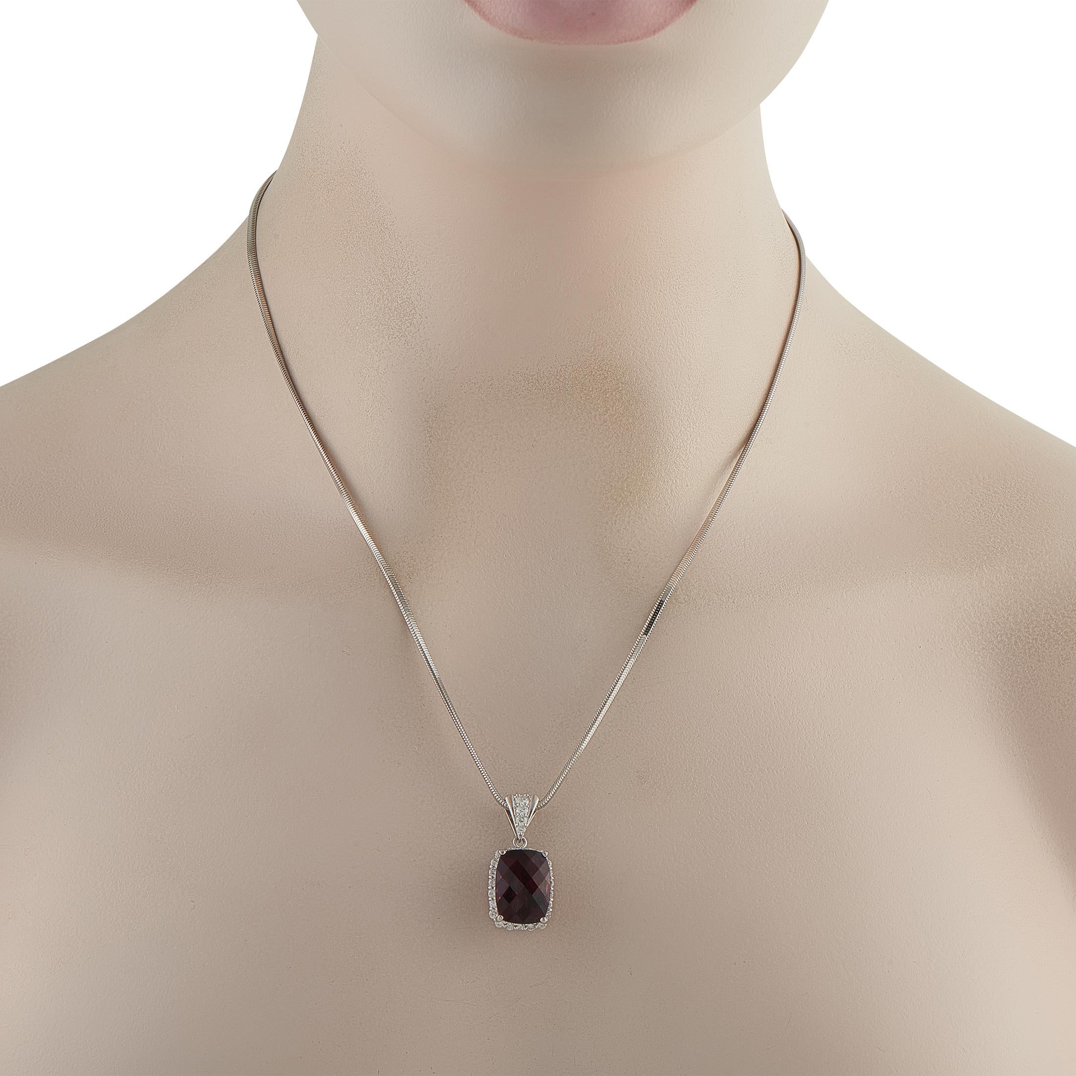 On this exquisite necklace, a 14.40 carat Rhodolite Garnet gemstone provides a stylish pop of color. Set in Platinum, the pendant measures 1.13 long by 0.50 wide and is suspended from a 19 chain. Diamond accents totaling 0.80 carats add the perfect