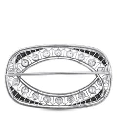 Spilla in platino con diamanti e zaffiri da 0,80 ct MF16-070126