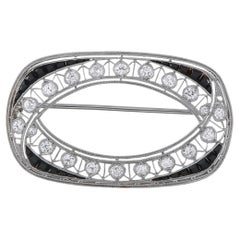 Spilla in platino con diamanti e zaffiri da 0,80 ct MF16-070126