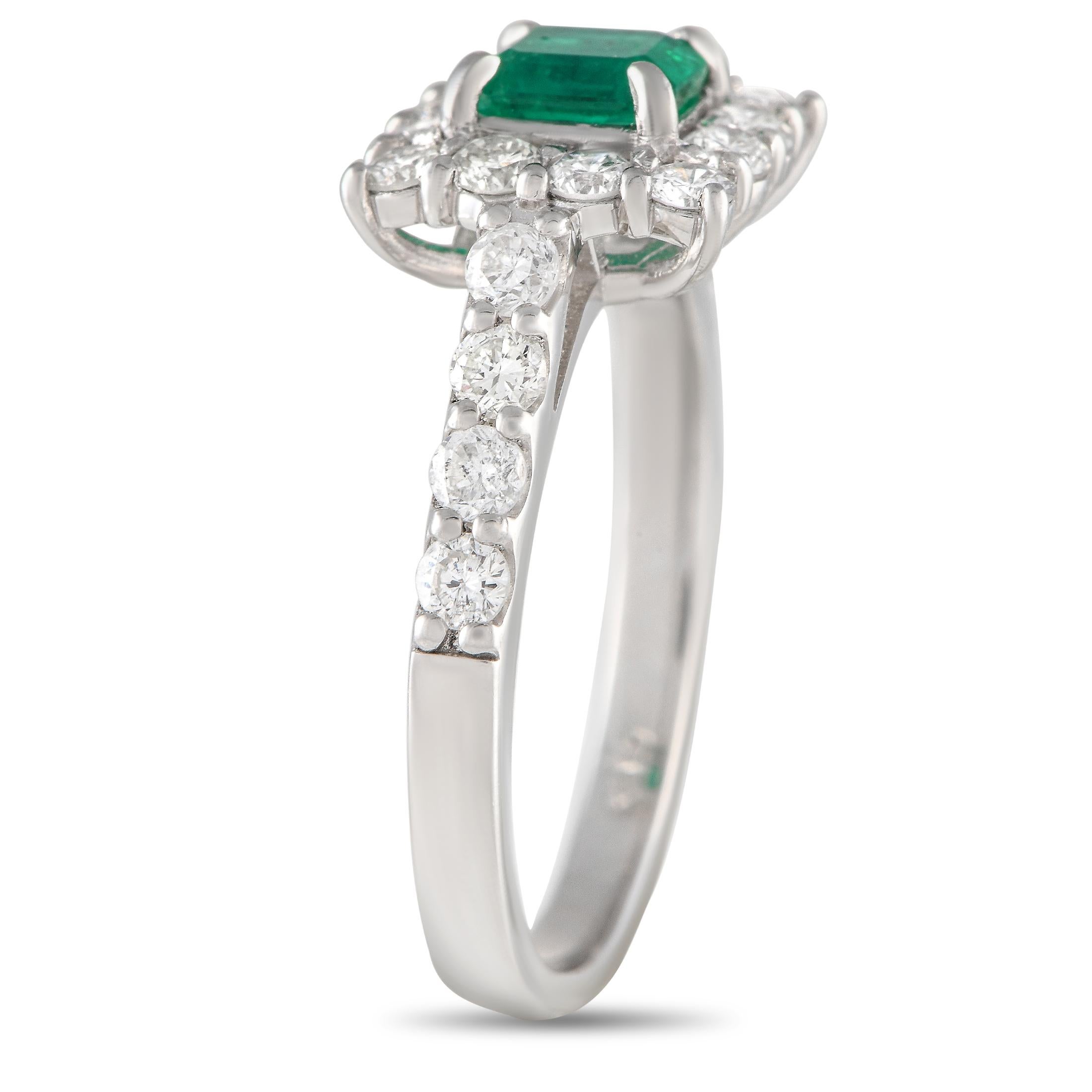 A 0.54 carat emerald center stone adds a pop of color to this impressive luxury ring. Elevated by sparkling diamonds totaling 0.82 carats, this pieces platinum setting features a 2mm wide band and a top height measuring 5mm.This jewelry piece is