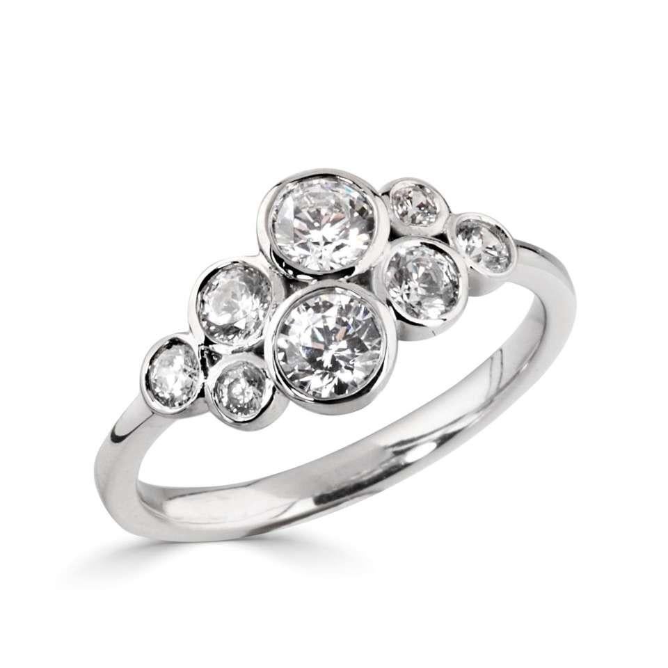 A timeless dress ring with a cluster of rubover set round diamond bubbles. ********** FREE pair of diamond stud earrings with every purchase! **********

Stone Size (mm) 2 X 4.0mm, 2 X 3.0mm, 2 X 2.5mm, 2 X 1.8mm

Total Carat Weight (ct)