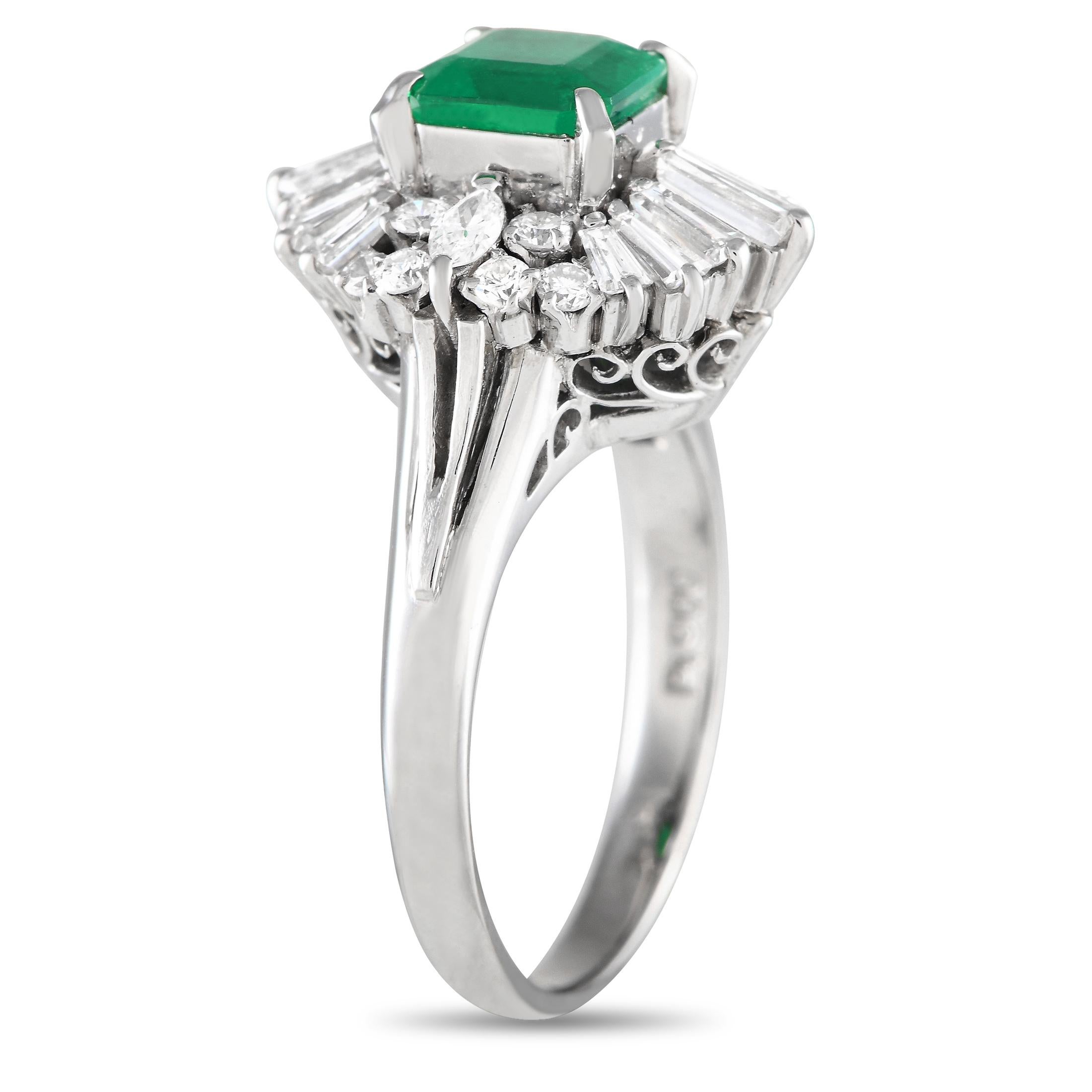 The delicate and detailed look of this Art Deco-inspired ring can't be missed. It features a polished band with grooved, split shoulders and a swirl-decorated gallery. Atop the ring is a 0.99 ct emerald stone on four prongs, surrounded by a
