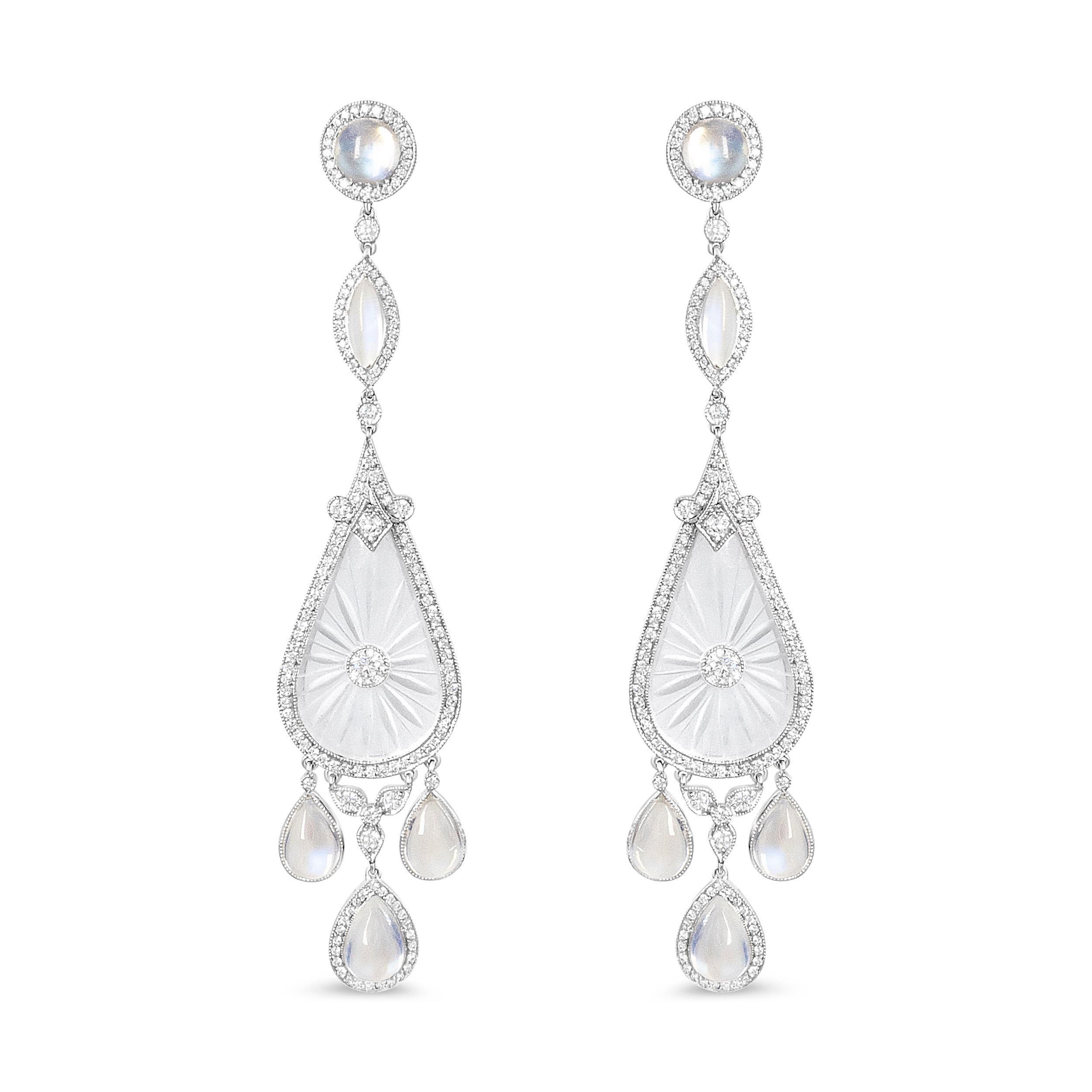 Enriched with intricate details, these unique earrings are the show-stopping accessory you've been long been searching! This alluring pair features a balanced combination of diamonds, alongside beautiful rock crystal and moon stone. Featured within