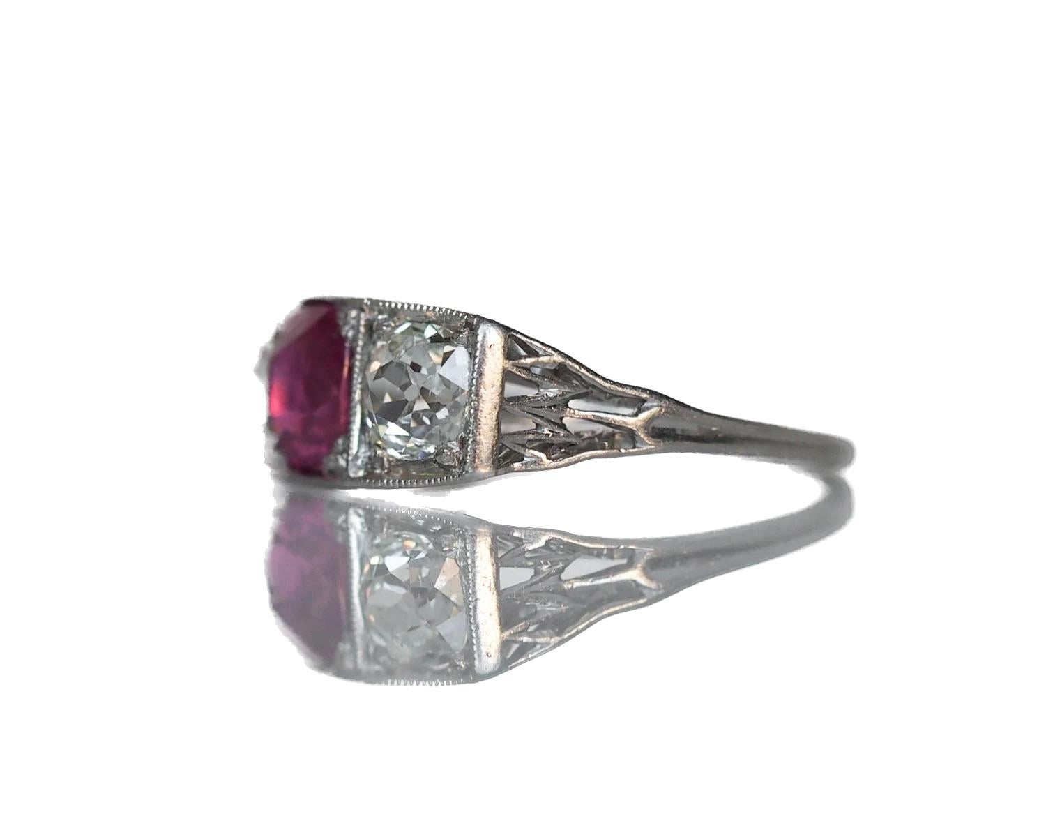 Circa 1920 - Platinum Art Deco 1.02ct Unheated Ruby & 1.20cttw Old Cushion Cut Diamond Engagement Ring - VEG#558

Ring Details: 
Size: 5.25
Metal Type: Platinum 
Weight: 3.3 g

Gem Stone Details:
Type: Ruby - Natural, Unheated
Shape: Antique