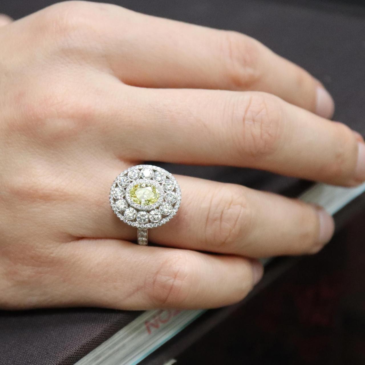 Platinum 1.03ct Oval Cut Diamond Light Fancy Yellow Halo Engagement Ring For Sale 3