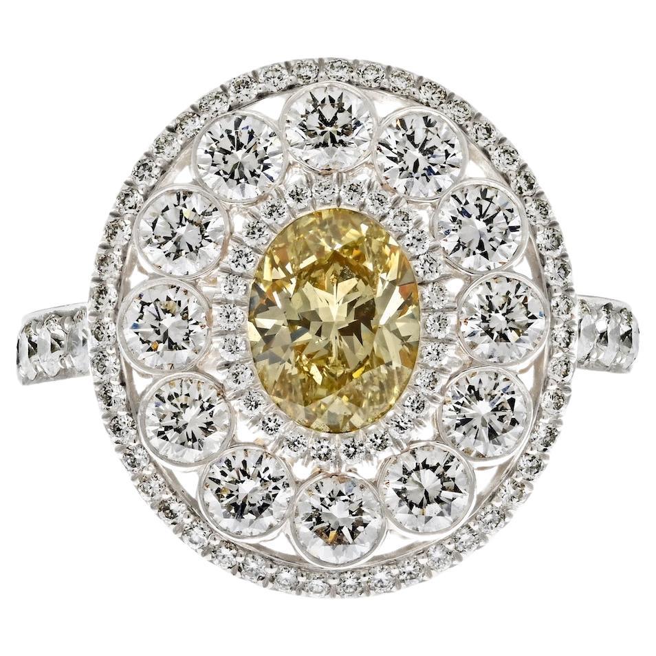 Platinum 1.03ct Oval Cut Diamond Light Fancy Yellow Halo Engagement Ring For Sale