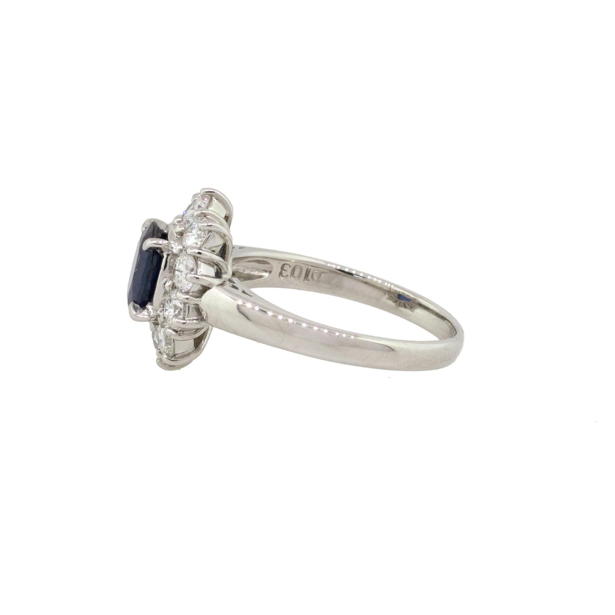 Material: Platinum
Center Gemstone Details: 1.03ct Blue Sapphire (Heat treated)
Adjacent Diamond Details: Approx. 1.0ctw of round cut diamonds. Diamonds are G/H in color and VS in clarity.
Ring Size: 6.5
Ring Measurements: 0.98