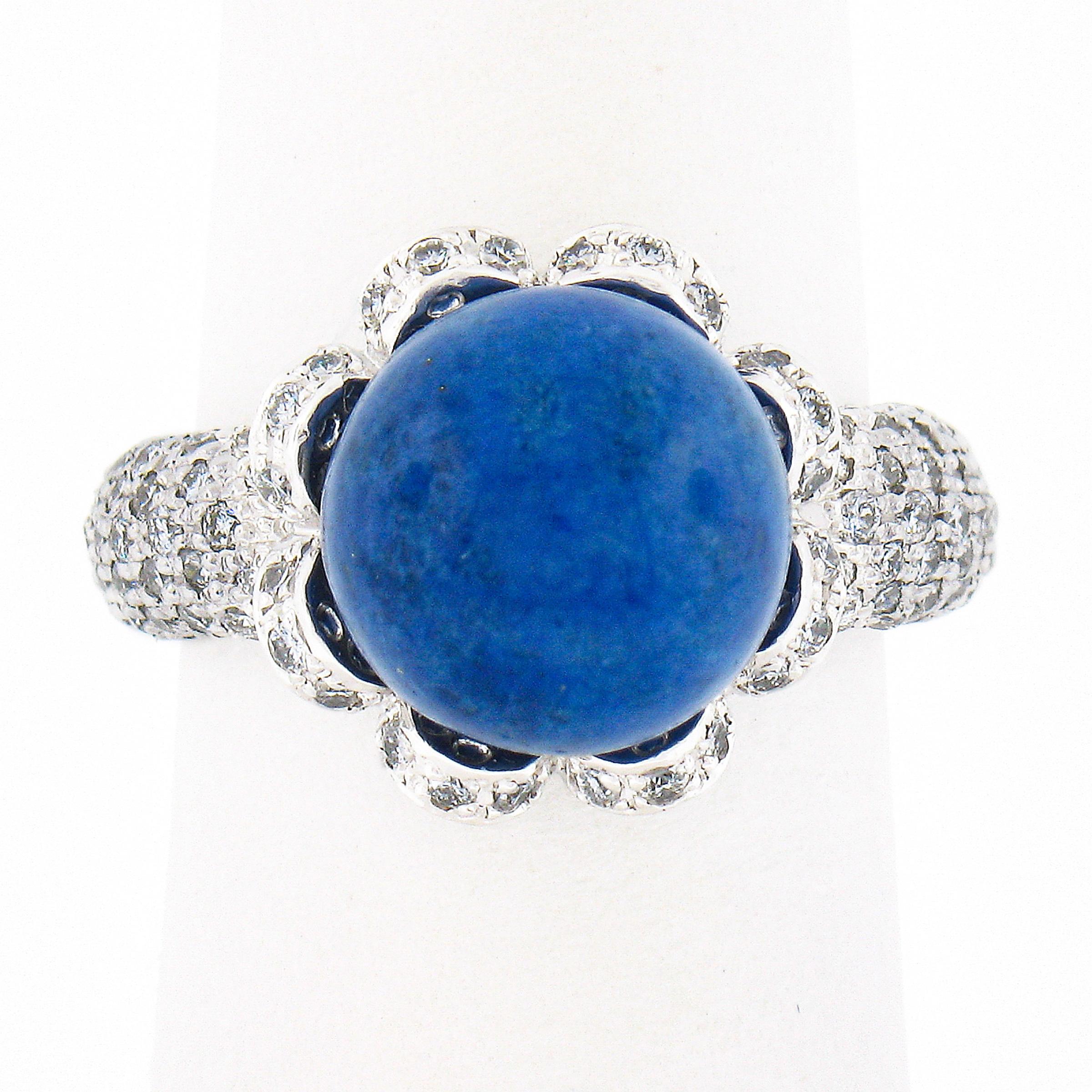 Here we have an absolutely magnificent and uniquely designed cocktail ring that is crafted from solid platinum. It features a gorgeous, 10.3mm, natural lapis stone neatly set at its center in the lovey flower shaped basket setting, and further