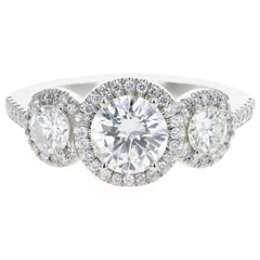 Platinum 1.04 Carat Round Brilliant Diamond Halo Three-Stone Engagement Ring