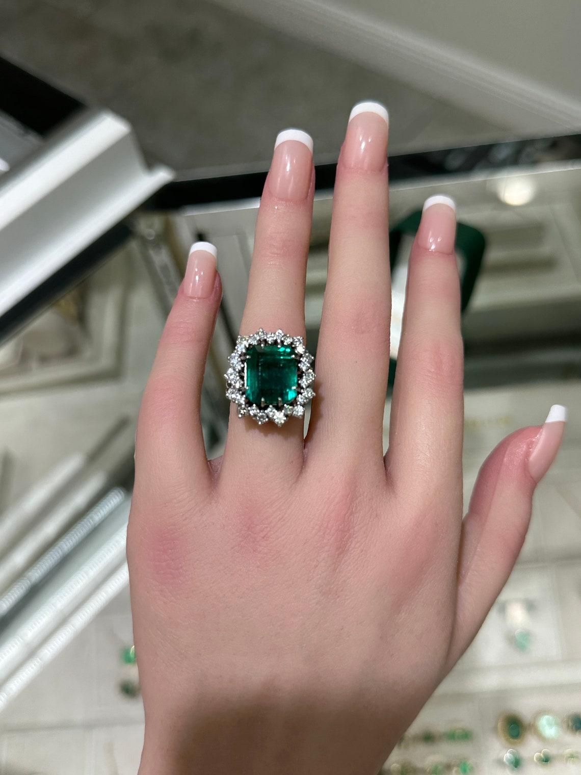 emerald engagement ring with halo