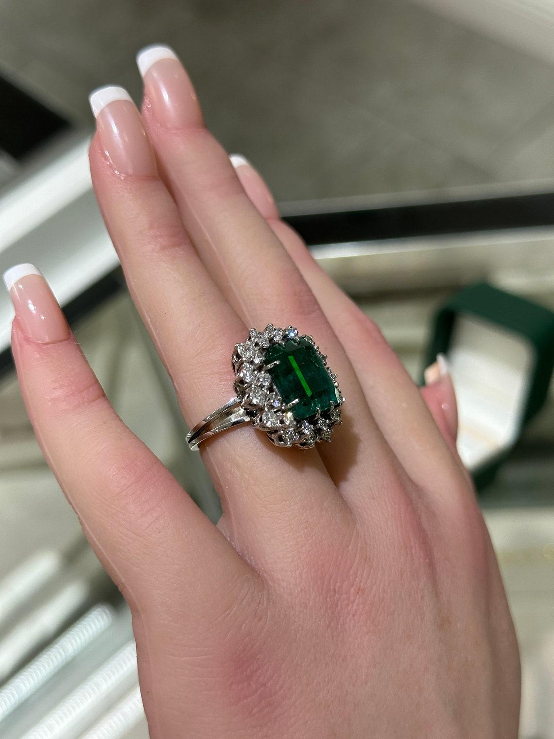 Platinum 10.40tcw Vintage Emerald Cut Emerald & Diamond Halo Ring, Dark Green In New Condition For Sale In Jupiter, FL