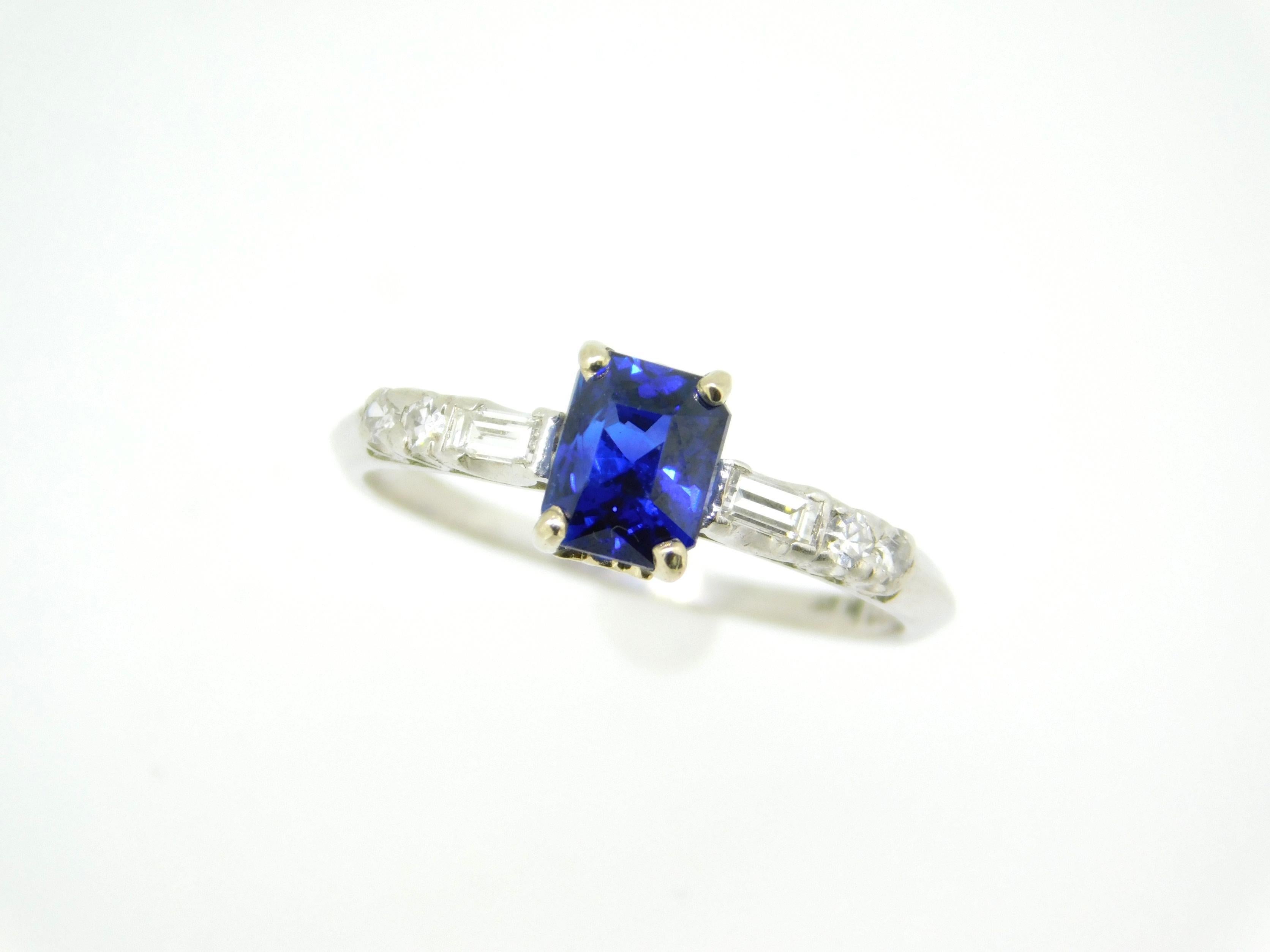 Platinum 1.05ct Blue Genuine Natural Sapphire and Diamond Ring (#J5052)

Platinum blue sapphire and diamond ring featuring a radiant cut sapphire weighing 1.05 carats. The sapphire has fine royal blue color and measures 5.65mm x 4.47mm. The sapphire