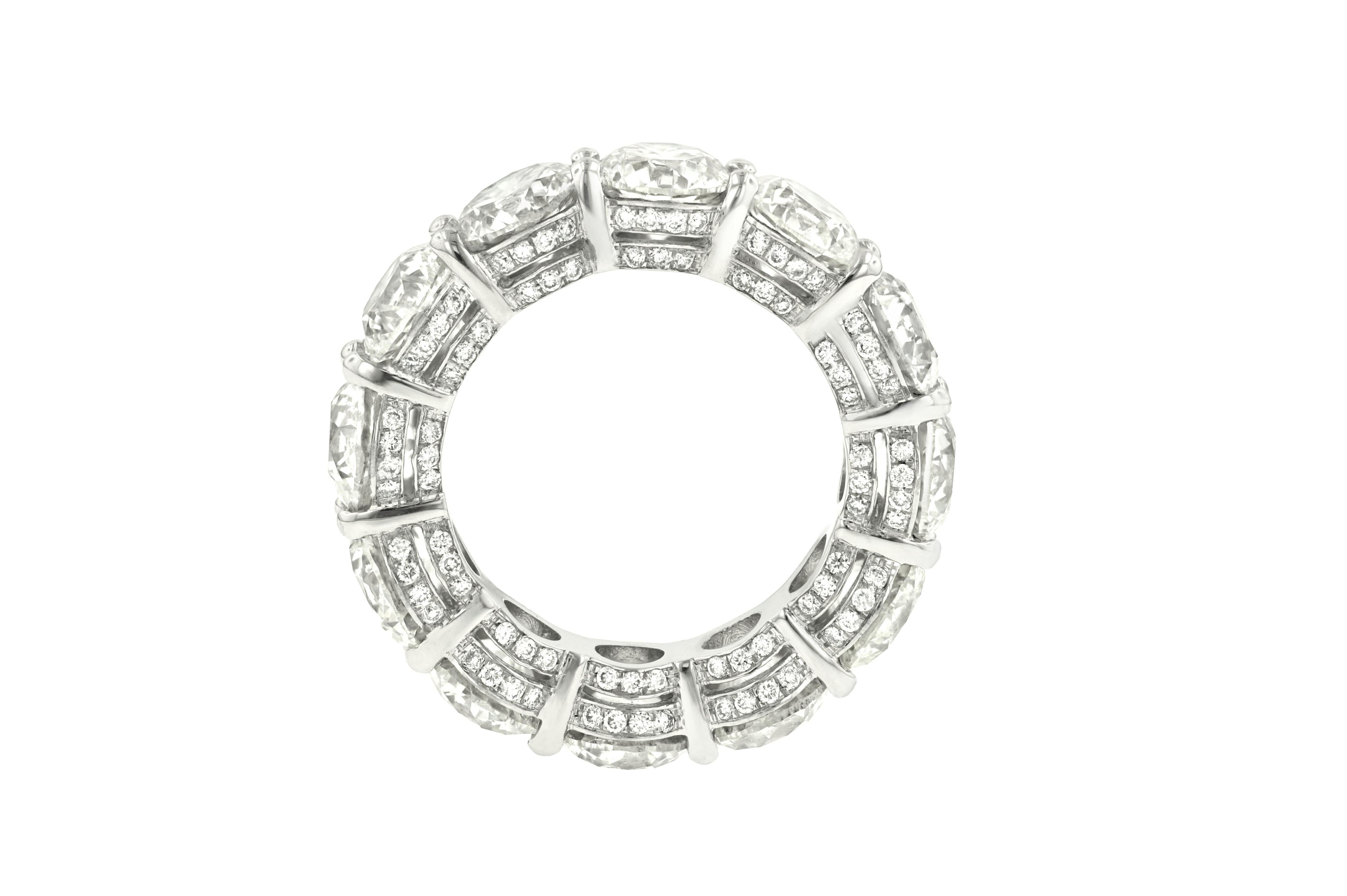 Platinum Diamond Eternity Band features 10.85 Carats of Round Brilliant cut diamonds, surrounded by 0.85 Carats of Diamonds. 12 stones total. The Diamond are G-H in Color SI in Clarity. 

