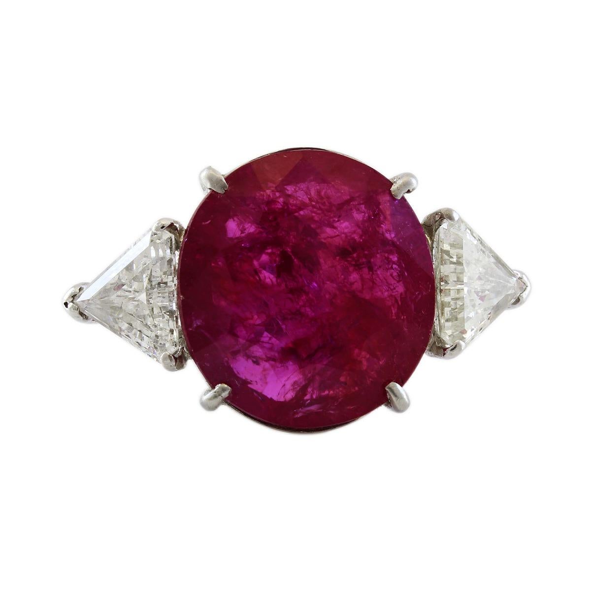 Platinum 11ct Natural Unheated Ruby and Diamond Cocktail Ring
Metal: Platinum
Gram Weight:  8.2 Grams
Diamond Carat Weight: 2 CTW 
Diamond Color: J-K
Diamond Clarity:  SI1-SI2
Diamond  Cut: Trillion Cut
Finger Size: 8.25 (US-Scale)
Gemstone: Natural