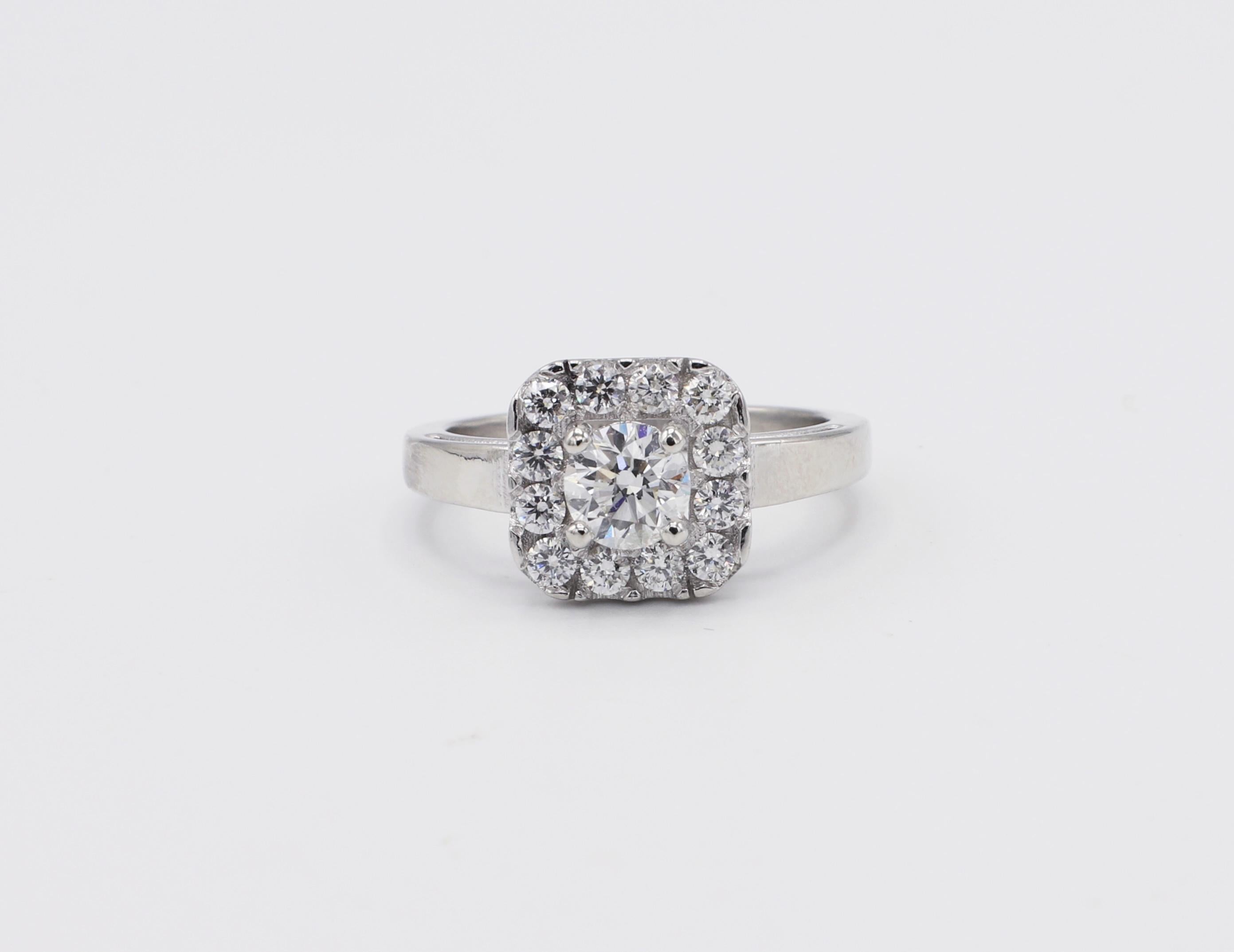 Platinum 1.10 CTW Round Diamond Halo Engagement Ring Size 6.5 
Metal: Platinum
Weight: 6.89 grams
Diamonds: Approx. 1.10 CTW G-H VS-SI, center stone is .60ct. 
Size: 6.5 (US)
Top of ring measures 10.5 x 10.5 mm
Band is 2mm at base
