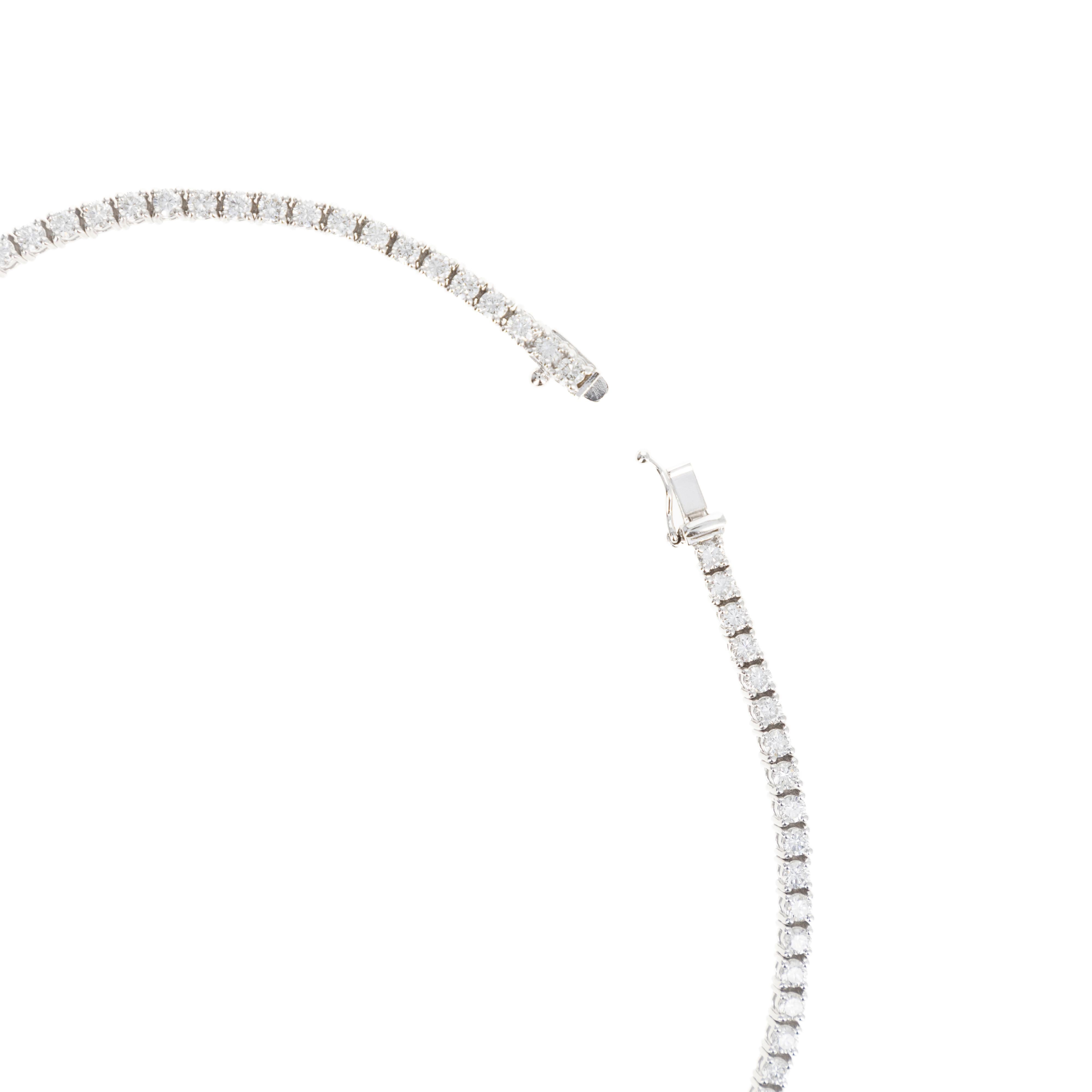 Era: New

Composition: Platinum

Primary Stone: One Round Brilliant Diamond

Carat Weight: Approximately 0.65 Carats

Color/Clarity: I / SI1

Accent Stones: Round Brilliant Diamonds

Carat Weight: 10.61 Carats In Total 

Color/Clarity: H-I /