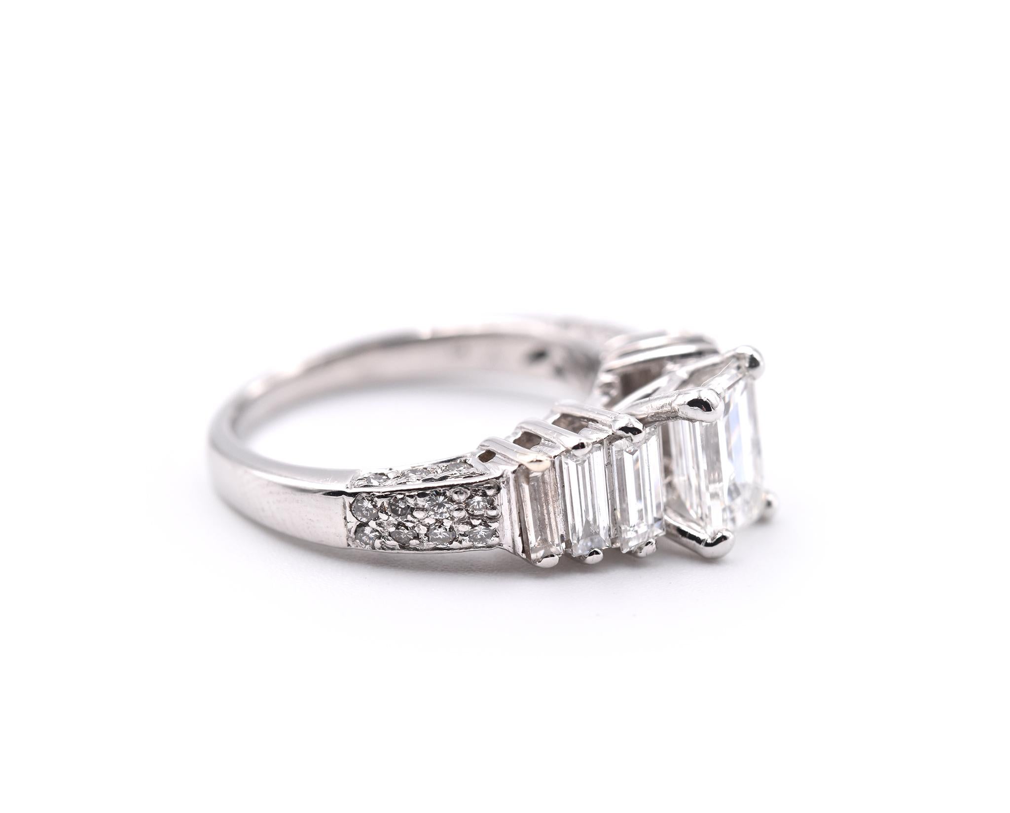 Designer: custom design
Material: platinum
Center Diamond: 1 emerald cut= 1.13ct   
Color: G
Clarity: SI2
Diamonds: 34 diamonds= 1.00cttw
Color: G
Clarity: SI2
Ring Size: 6 ¼ (please allow two additional shipping days for sizing