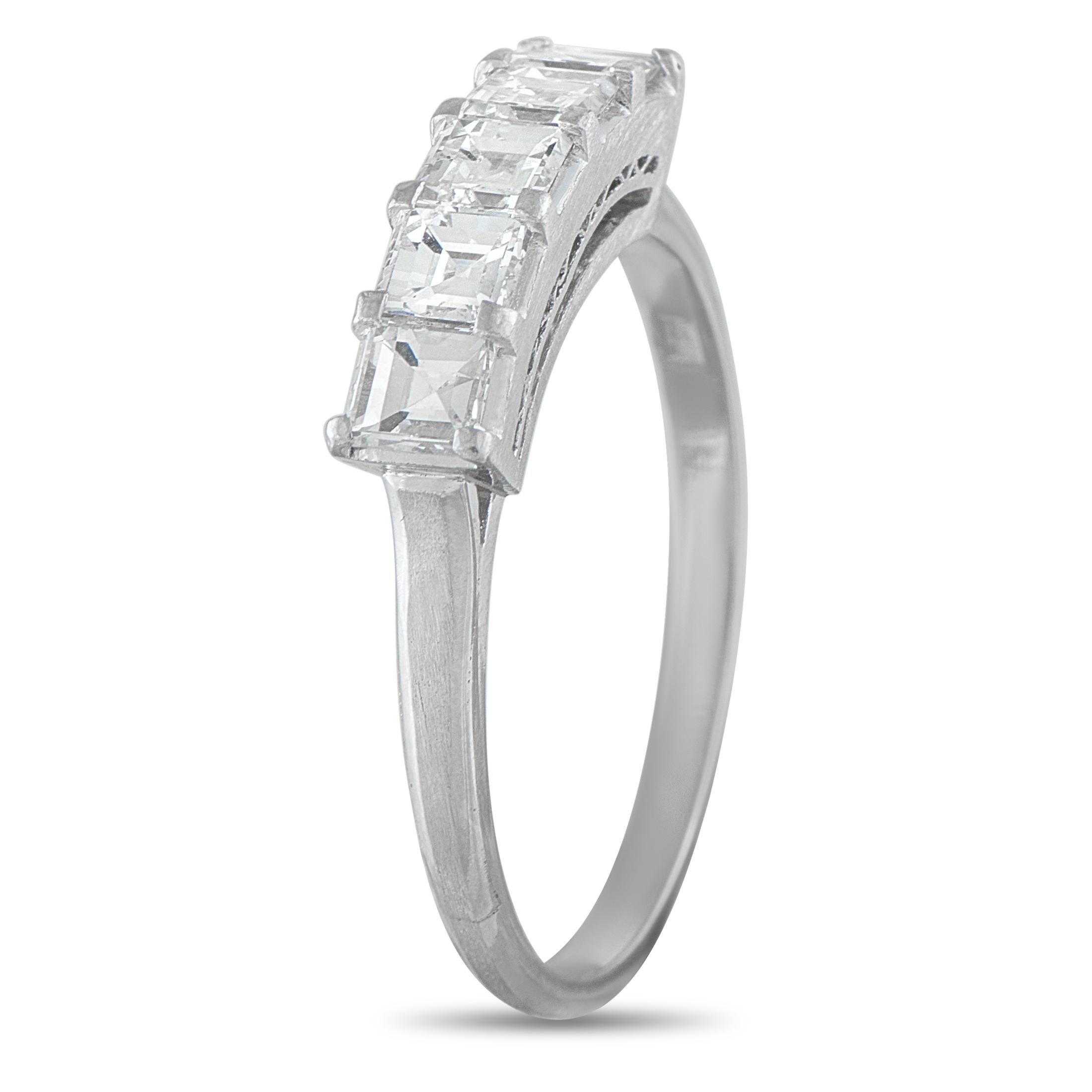 A delicate Platinum setting beautifully showcases a series of square-cut Diamonds totaling 1.15 carats on this impeccably crafted ring. Ideal for wear alone or stacked with other pieces from your collection, it features a 2mm wide band and a 6mm top