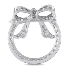 Broche en forme de nœud circulaire en platine sertie d'un diamant de 1,20 ct – MF15-070826
