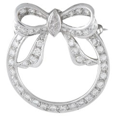 Broche en forme de nœud circulaire en platine sertie d'un diamant de 1,20 ct – MF15-070826