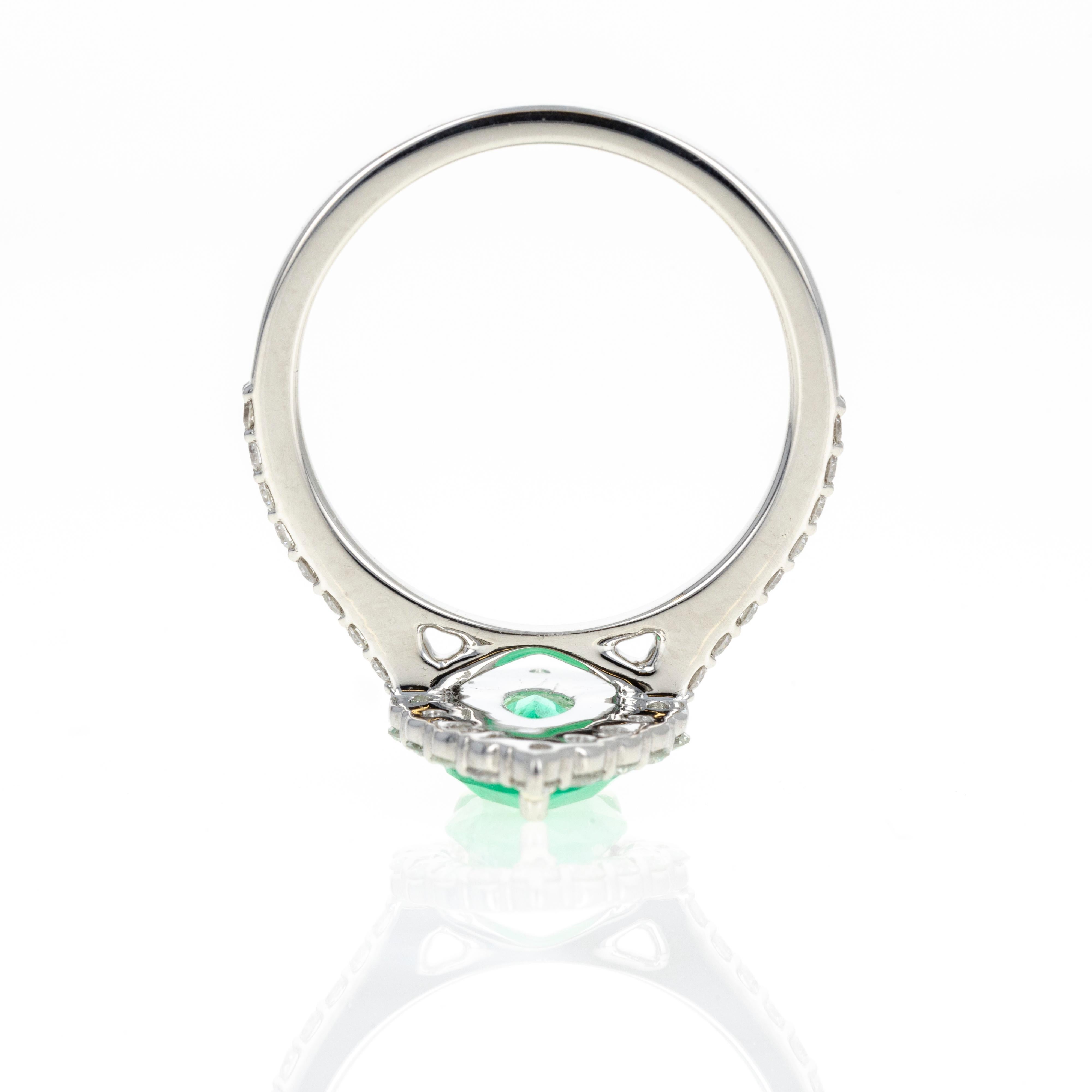 Era: New
Composition: Platinum
Primary Stone: Pear Cut Natural Emerald
Carat Weight: Approximately 1.23 Carats
Accent Stone: Thirty Two Round Brilliant Diamonds
Carat Weight: Approximately 0.73  Carats in Total
Color/Clarity: F-G / VS1-2
Ring Size: