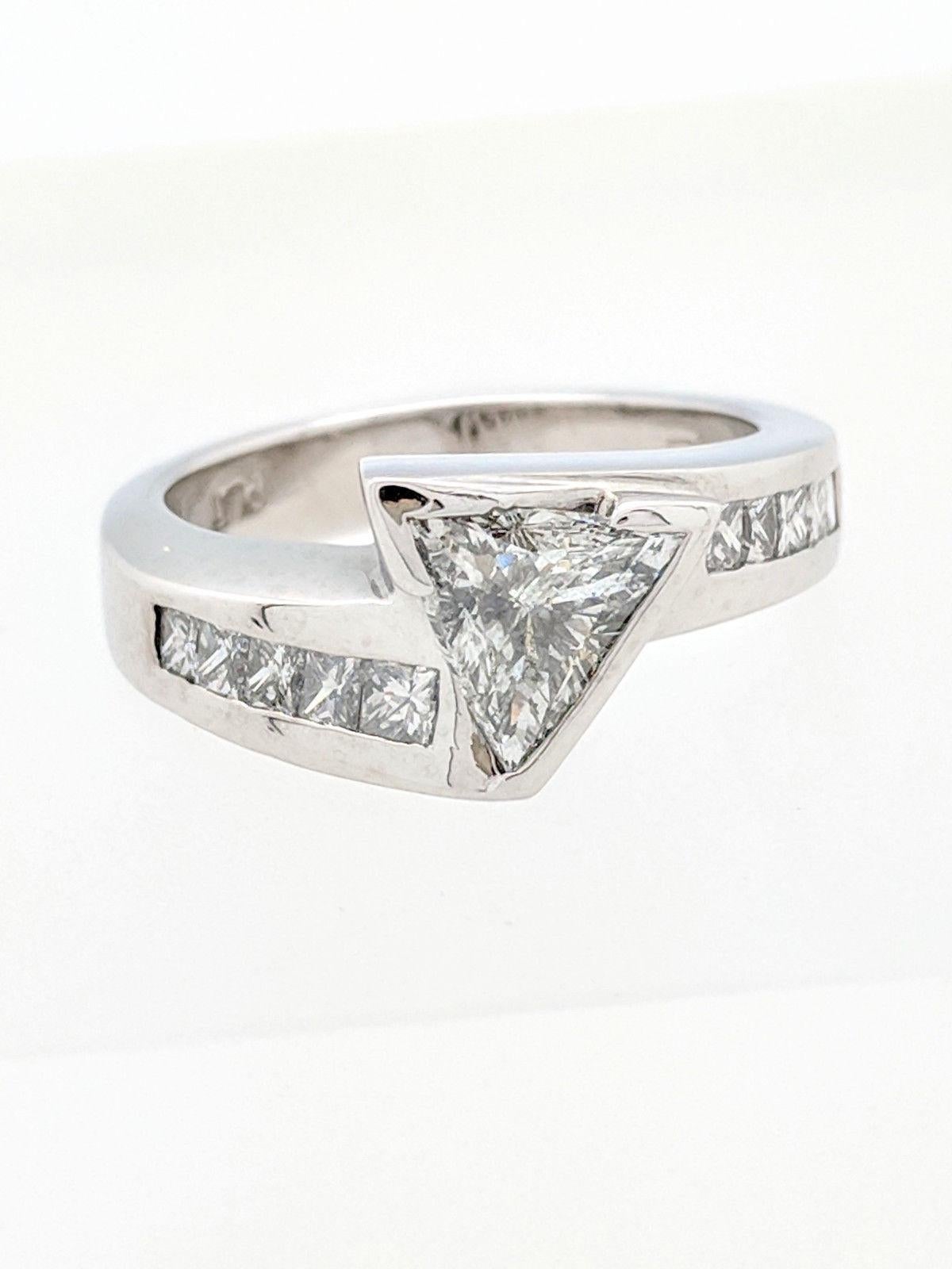 You are viewing a beautiful 1.25ct natural trillion cut diamond. We estimate this diamond to be SI1 in clarity and H in color. The diamond is beautifully displayed in a channel set platinum princess cut diamond ring setting. We estimate this setting