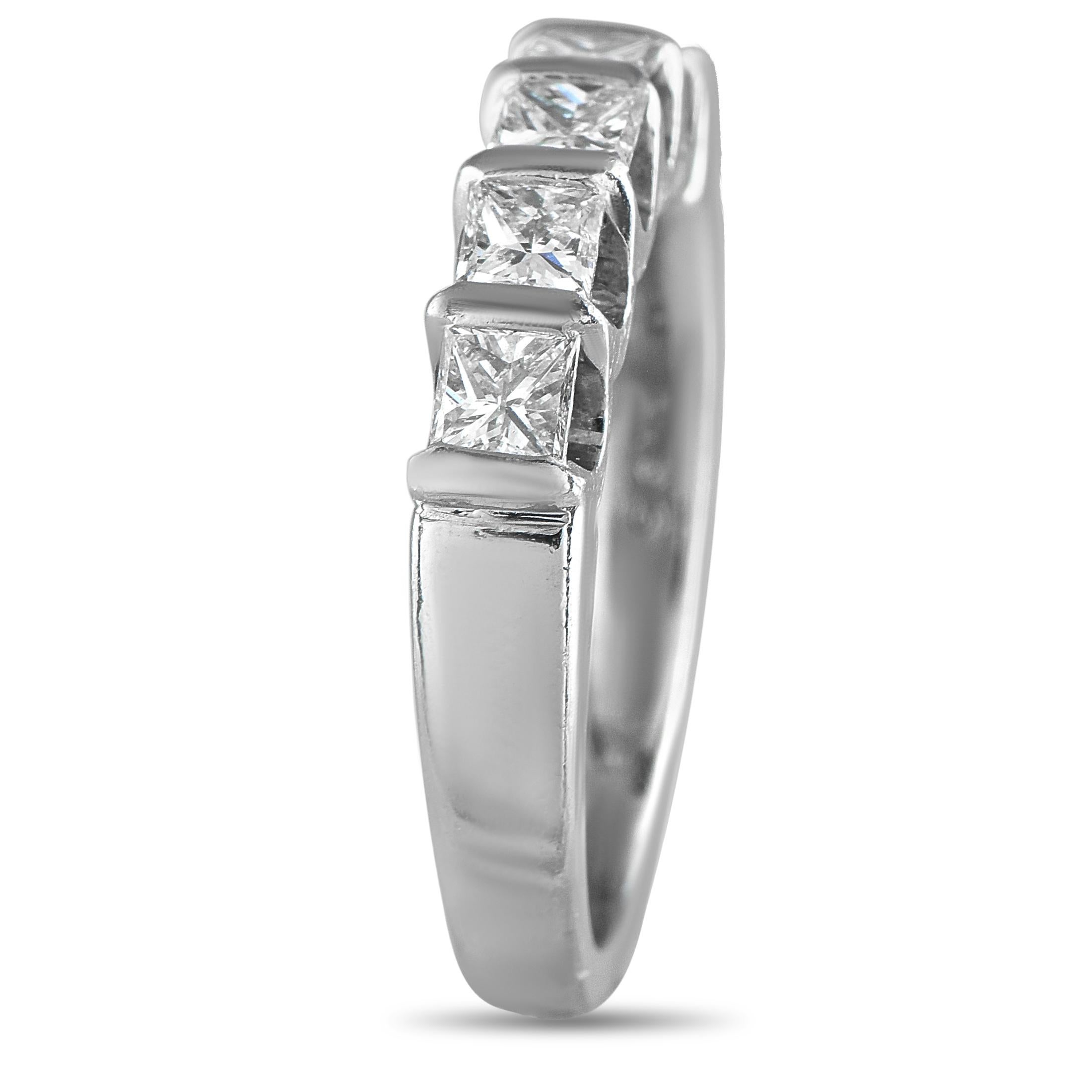 Celebrate lasting love with a five-stone diamond ring in platinum. Timeless in style and rich in symbolism, this piece evokes quiet strength and represents enduring love. Each stone is flawlessly set on a U-shaped half-bezel setting, carrying each