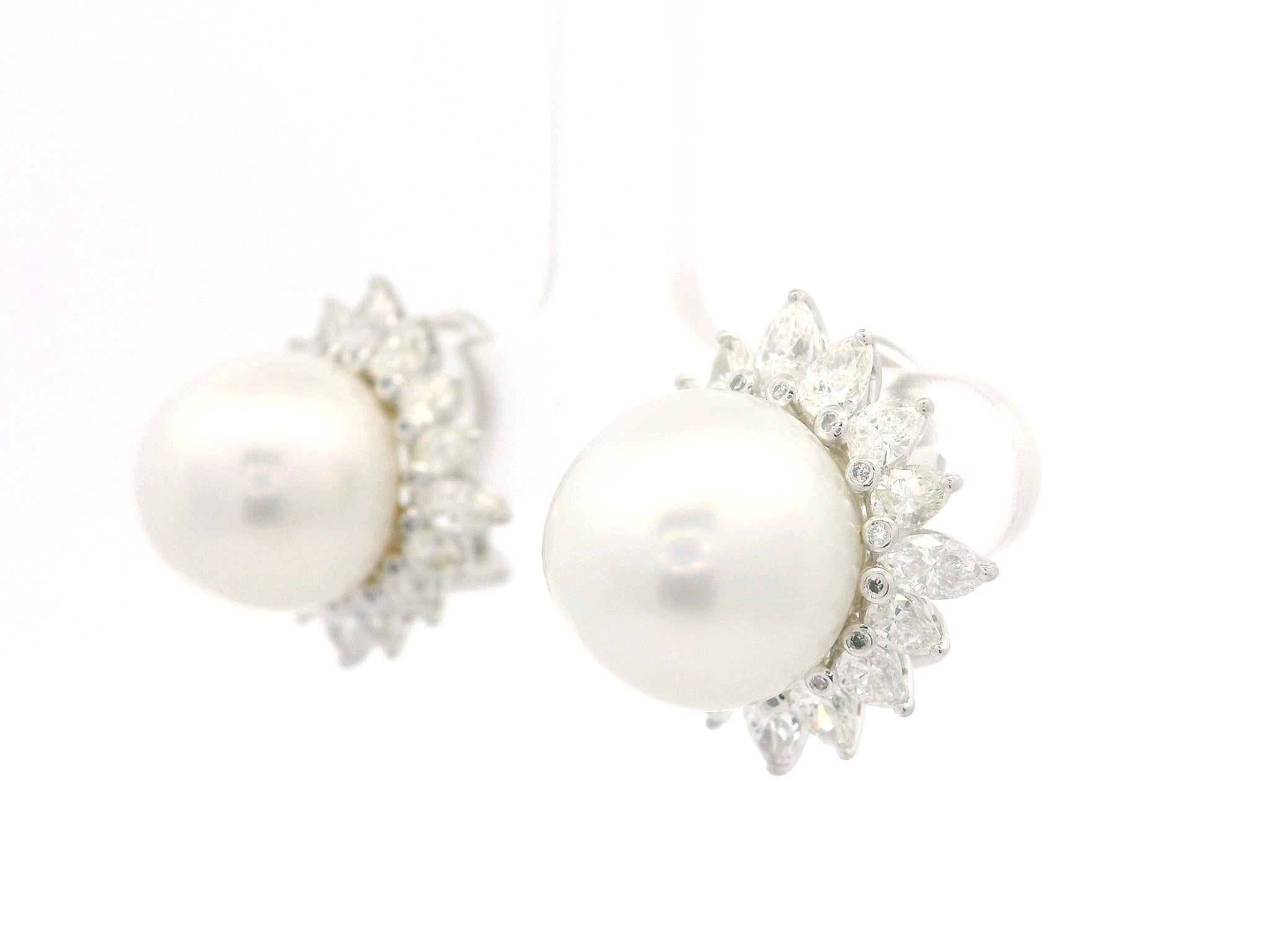 --Stone(s):--
(2) Genuine Cultured Pearls - Round Shape - Nice White Color - Nice Luster - 12.65mm each (approx.)
(32) Natural Genuine Diamonds - Marquise & Pear Cut - Prong Set - VS1/VS2Clarity - G/H Color - 3.20ctw (approx.)
Numerous Genuine