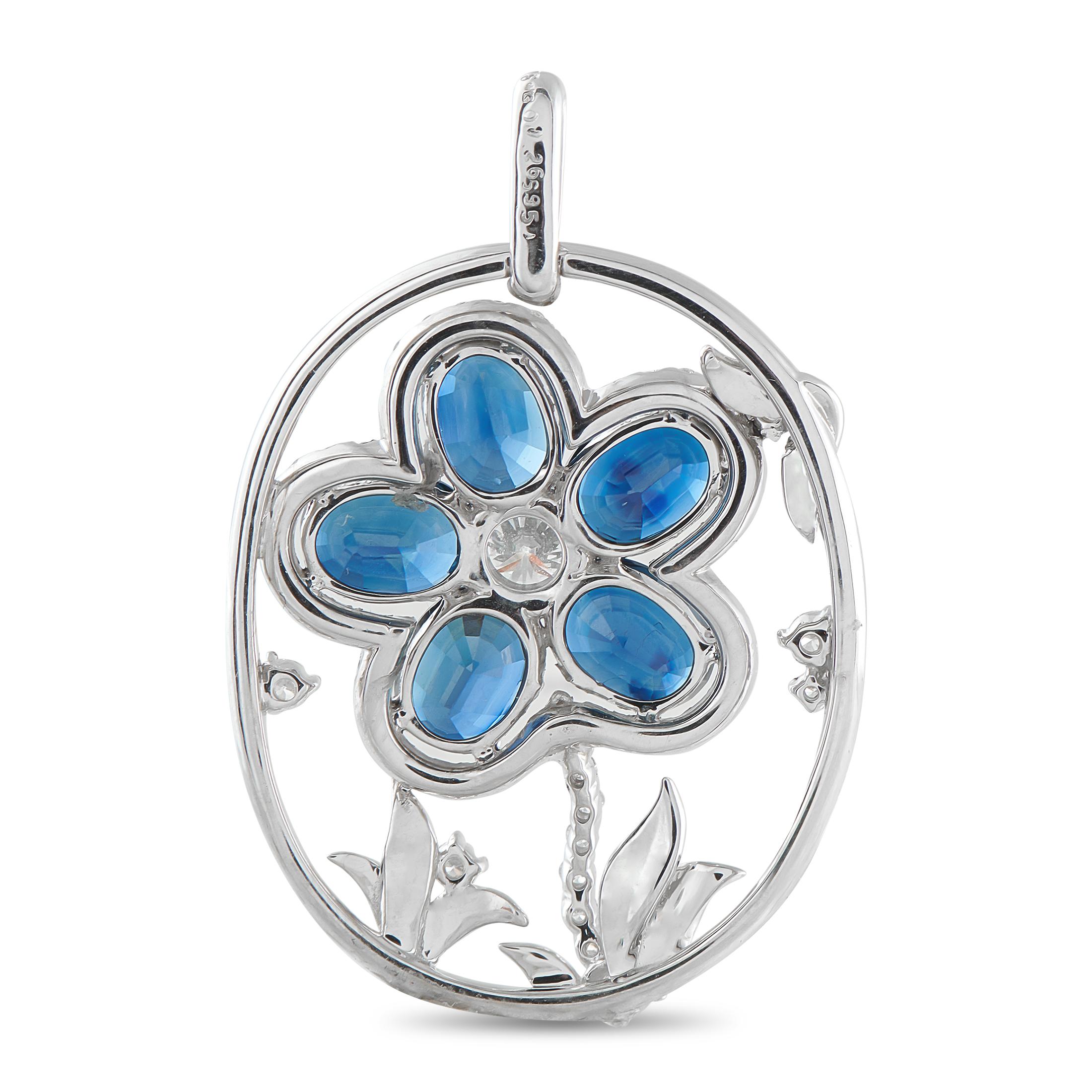 Shaped with precision and color harmony, this platinum pendant captures the moment a flower comes to life in gemstone form. It features five oval sapphire petals totaling 9.51 carats, forming the bloom with their rich blue tones. Fine diamonds trace