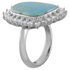 Ring aus Platin mit einem Diamanten von 1,30 Karat und einem Opal