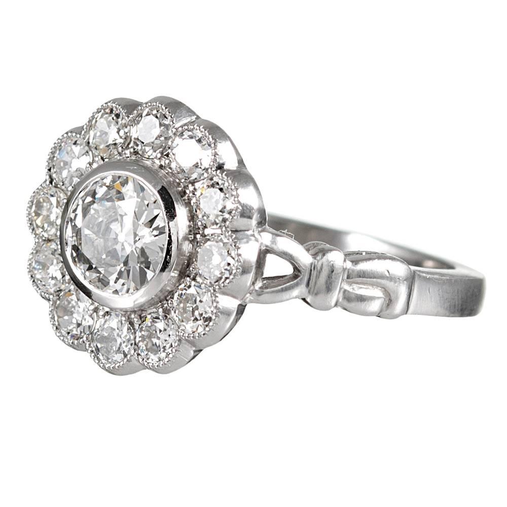 “Old diamonds in a new mounting” offer the authentic look of antique cut stones, yet with the physical integrity of new manufacture. The setting is rendered in platinum and set in the center with a .69 Carat old European cut diamond that exhibits J