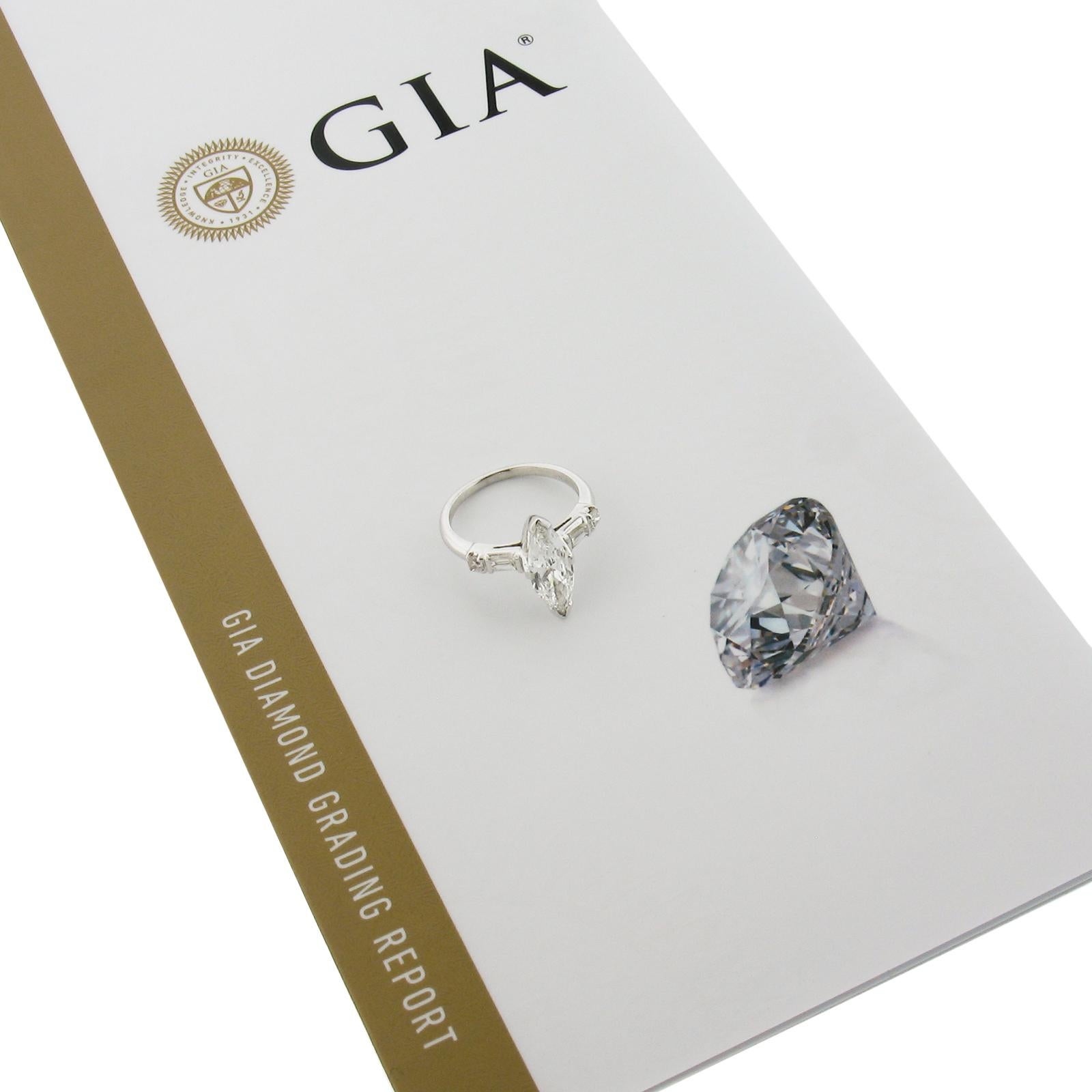 --Stone(s):--
(1) Natural Genuine Diamond - Marquise Brilliant Cut - V Prong Set - F Color - VS1 Clarity - Long 2.16 Ratio - 1.16ct (exact - certified)
** See Certification Details Below for Complete Info **
(2) Natural Genuine Diamonds - Tapered